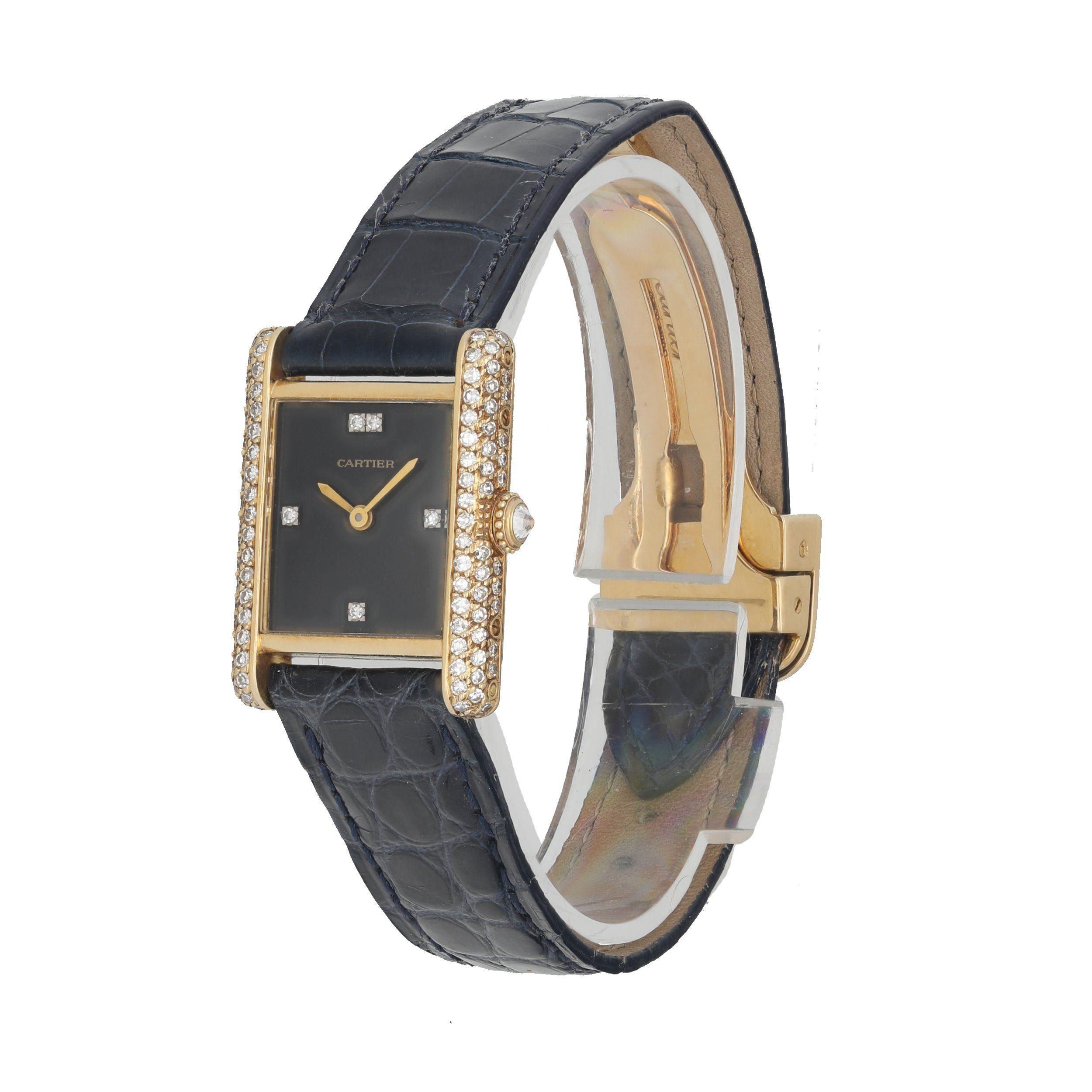 Cartier Tank Paris 78227Â Ladies Watch. 20mm 18k Yellow gold case with factory diamonds set. 18K Yellow Gold Stationary bezel with diamonds. Onyx dial with gold hands and diamond hour marker. Black leather strap with 18K yellow gold deployment