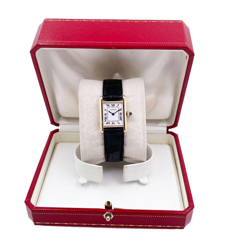 Model: Tank 2442

 

Case Material: 18K Yellow Gold

 

Band: Black Leather Band 

 

Bezel:  18K Yellow Gold

 

Dial: White / Ivory 

 

Face: Sapphire Crystal 

 

Case Size: Approximately 23mm x 29mm

 

Includes: 

-Cartier Box

-Certified