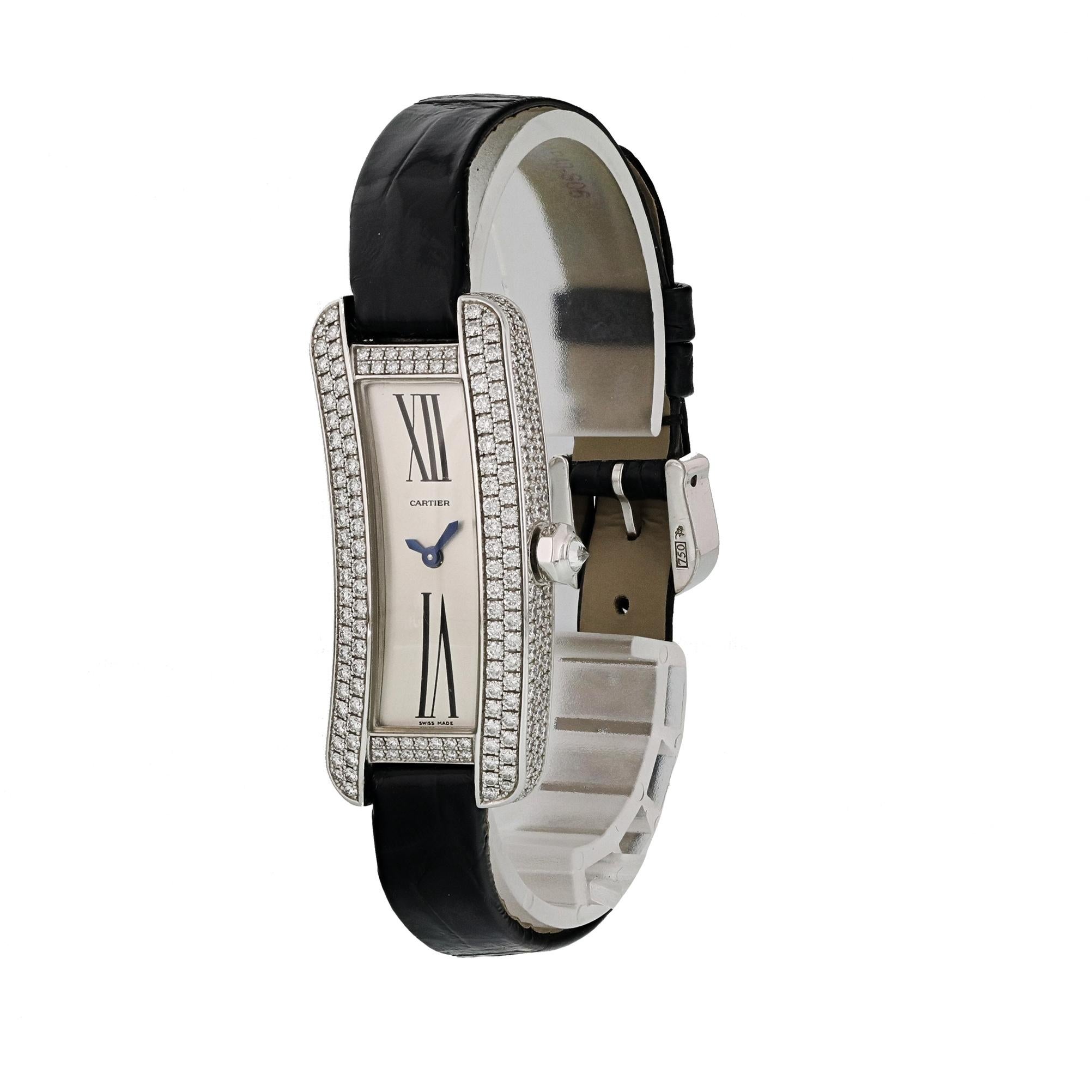 Cartier Tank S Americaine 2625 White Gold Diamond Ladies Watch.
16mm 18K White Gold case with handset Diamonds. 
White Gold Stationary bezel handset with diamonds.
Silver dial with blue steel hands and Roman numeral hour markers. 
Leather Strap with