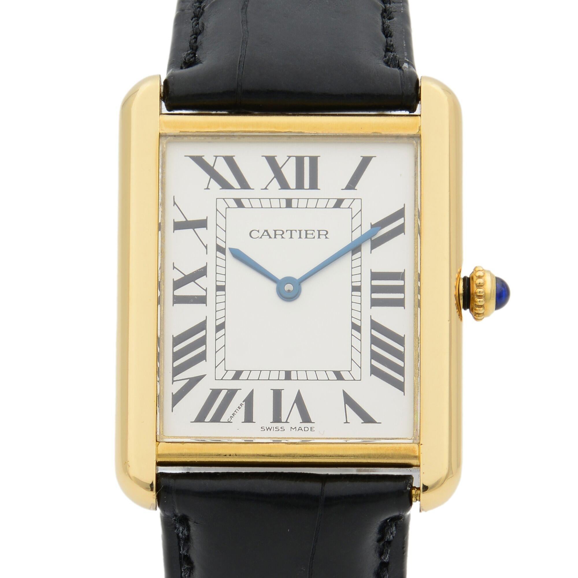 This pre-owned Cartier Tank W5200004  is a beautiful Ladie's timepiece that is powered by quartz (battery) movement which is cased in a yellow gold case. It has a  rectangle shape face, no features dial and has hand roman numerals style markers. It