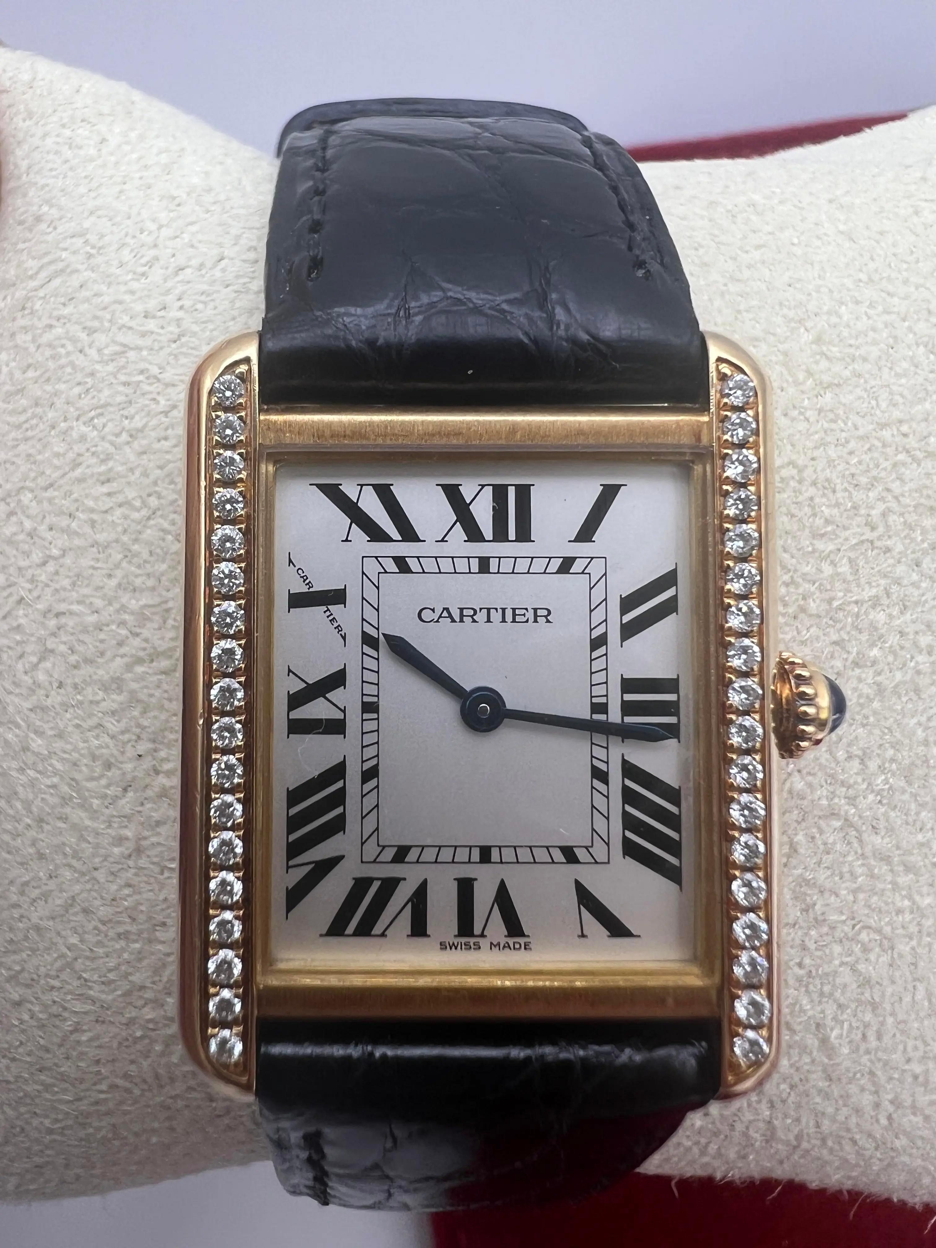 Pristine condition Cartier Tank Solo, reference W1018755, featuring a luxurious professionally custom set diamond bezel. This elegant timepiece showcases a 24mm x 30.5mm yellow gold case, embodying Cartier's iconic rectangular design with classic