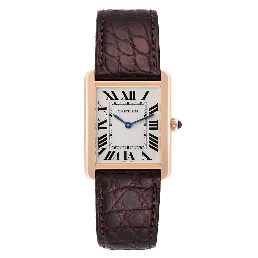 Cartier Tank Solo Large Rose Gold Steel Brown Strap Mens Watch W5200025 Card. Quartz movement. 18k rose gold case 34.0 x 27.0 mm. Stainless steel case back. Circular grained crown set with a blue spinel cabochon. . Scratch resistant sapphire