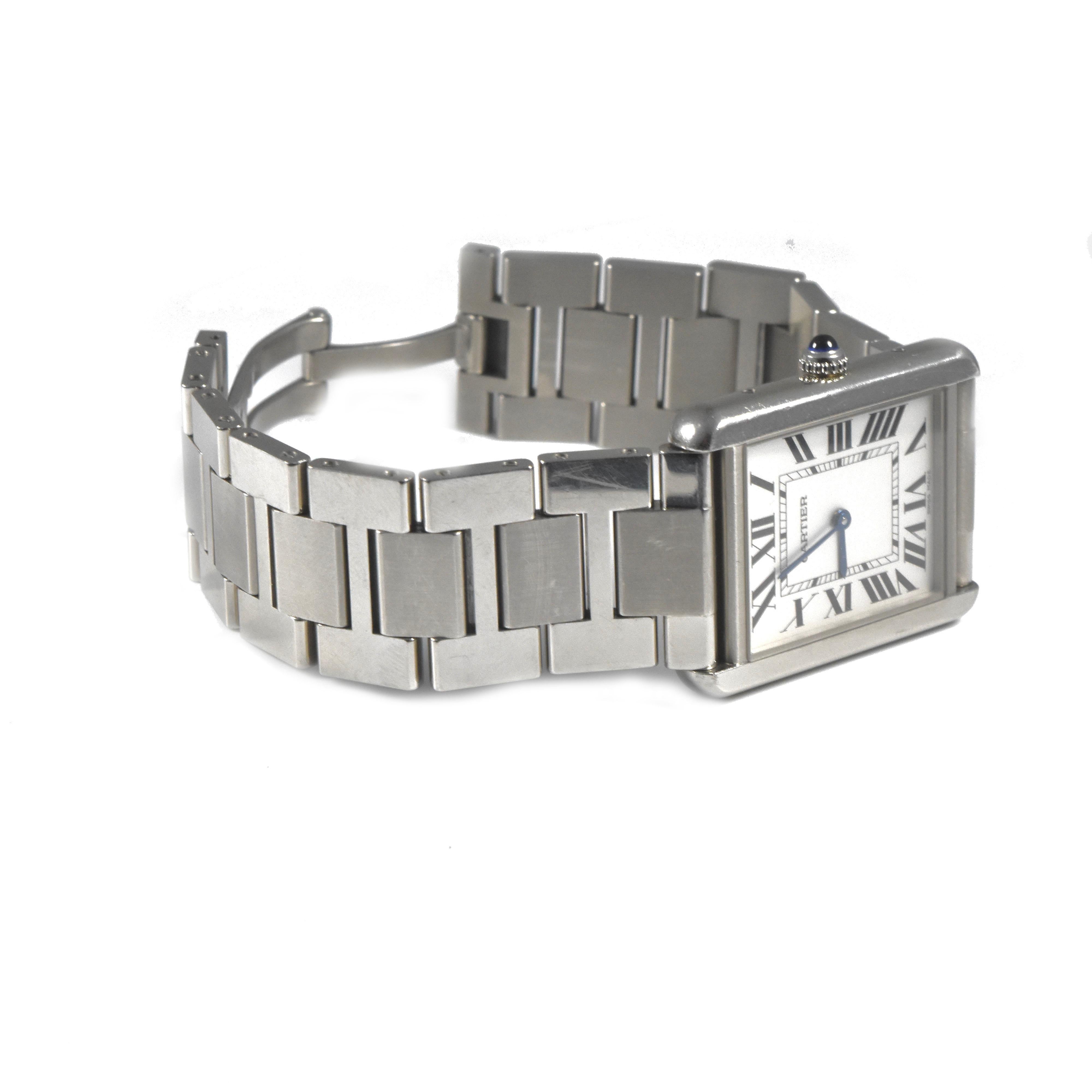 Brand : Cartier
Series : Tank Solo
Ref No : 3169
Metal : Stainless Steel
Movement :  Quartz
Case Material : Stainless Steel
Case Size : 34.8 x 27.4 millimeters
Dial : Silvered opaline
Crystal : Scratch resistant sapphire
Bracelet Material : 