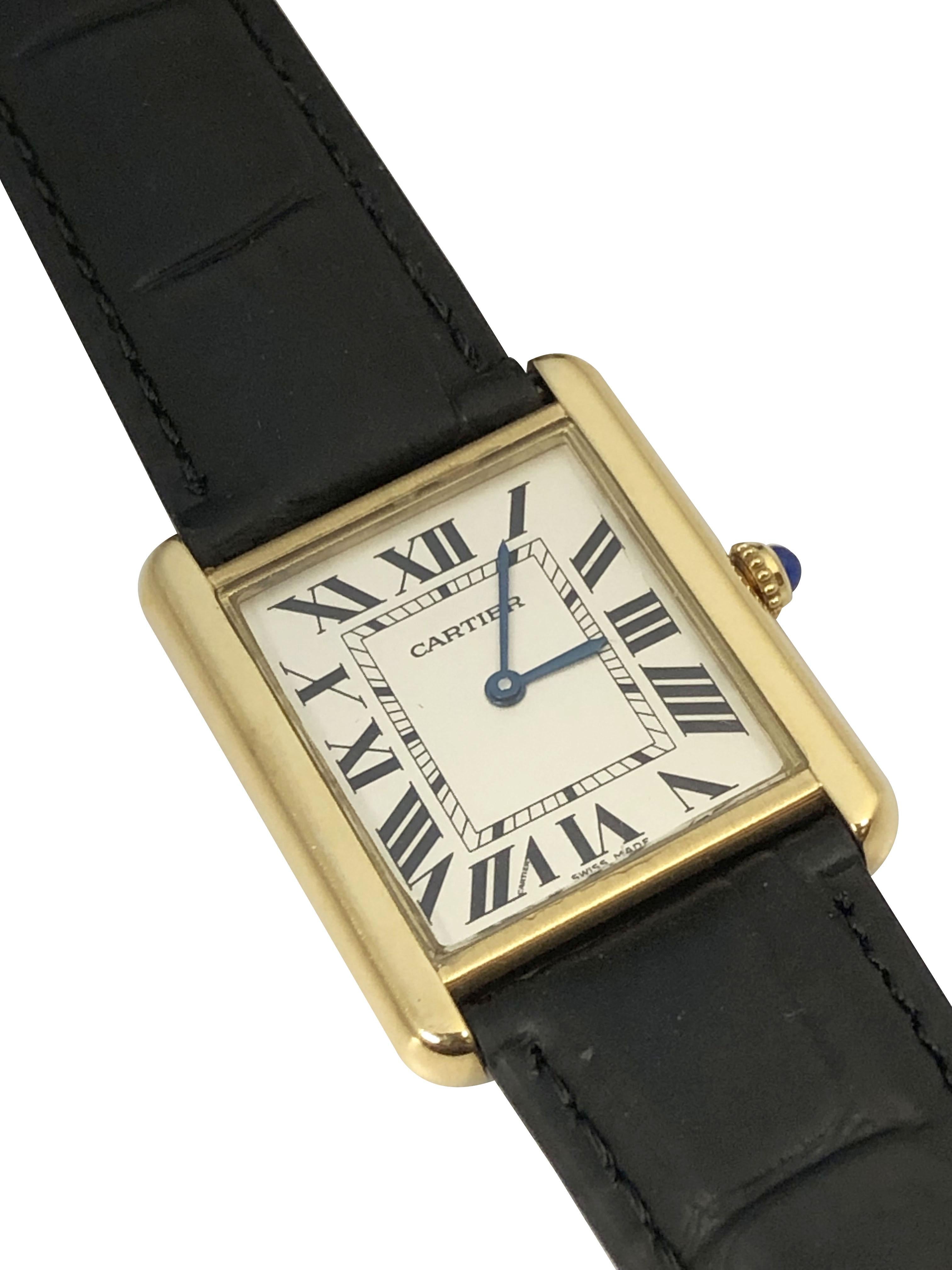 Circa 2018 Cartier Tank Solo reference 2742 Large Wrist Watch. 34 X 27 MM water resistant 18k Yellow Gold with Steel Case back, Sapphire crown, Scratch resistant sapphire crystal, quartz Movement, White dial with Black Roman numerals. Sword shaped