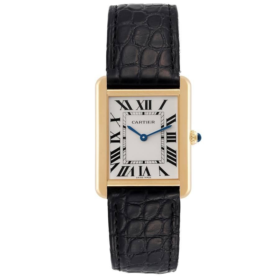 Cartier Tank Solo Large Yellow Gold Steel Mens Watch W5200004 Card. Quartz movement. 18k yellow gold case 34 mm x 27 mm. Stainless steel case back. Circular grained crown set with a blue spinel cabochon. . Scratch resistant sapphire crystal. Silver