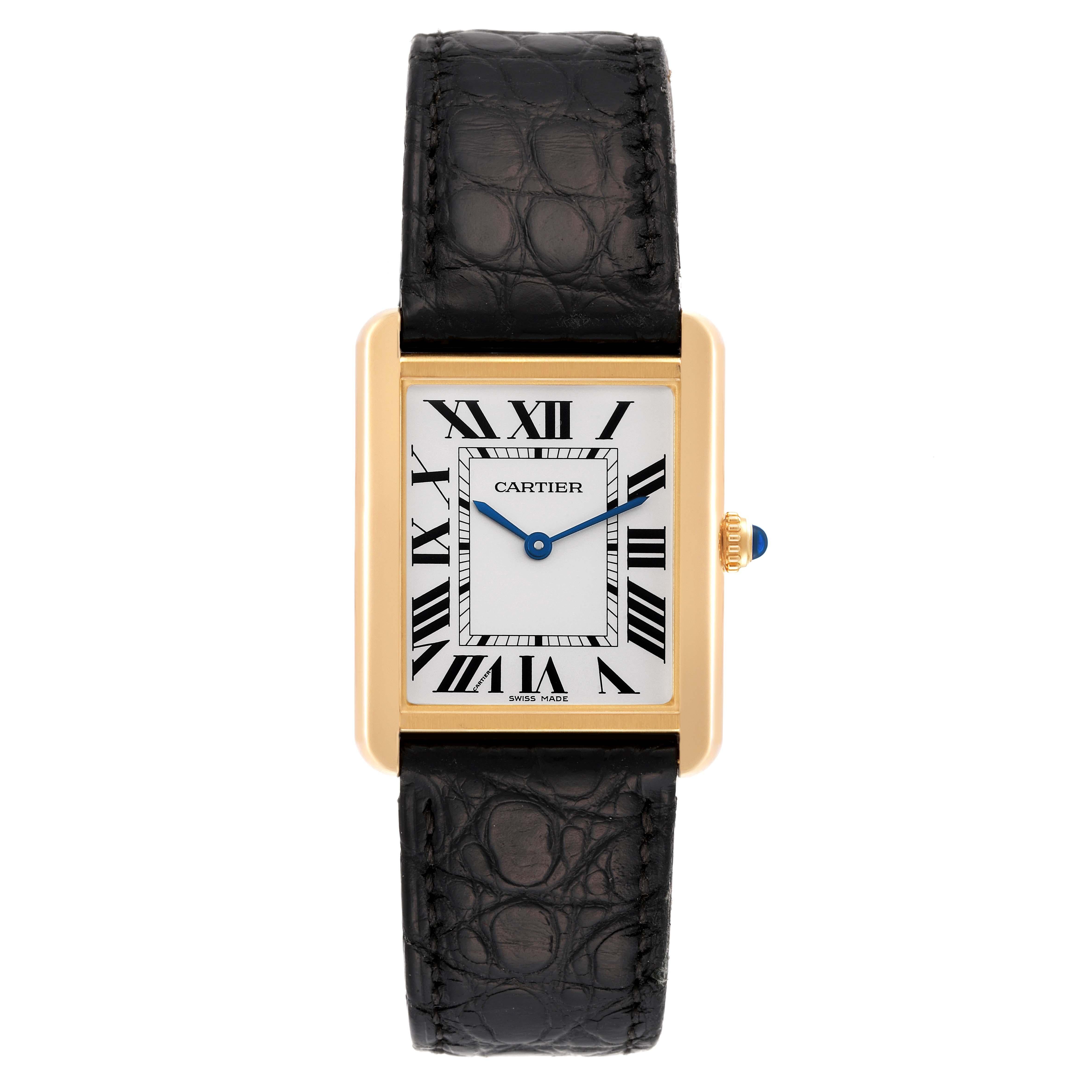 Cartier Tank Solo Large Yellow Gold Steel Mens Watch W5200004 Card. Quartz movement. 18k yellow gold case 34 mm x 27 mm. Stainless steel case back. Circular grained crown set with a blue spinel cabochon. . Scratch resistant sapphire crystal. Silver
