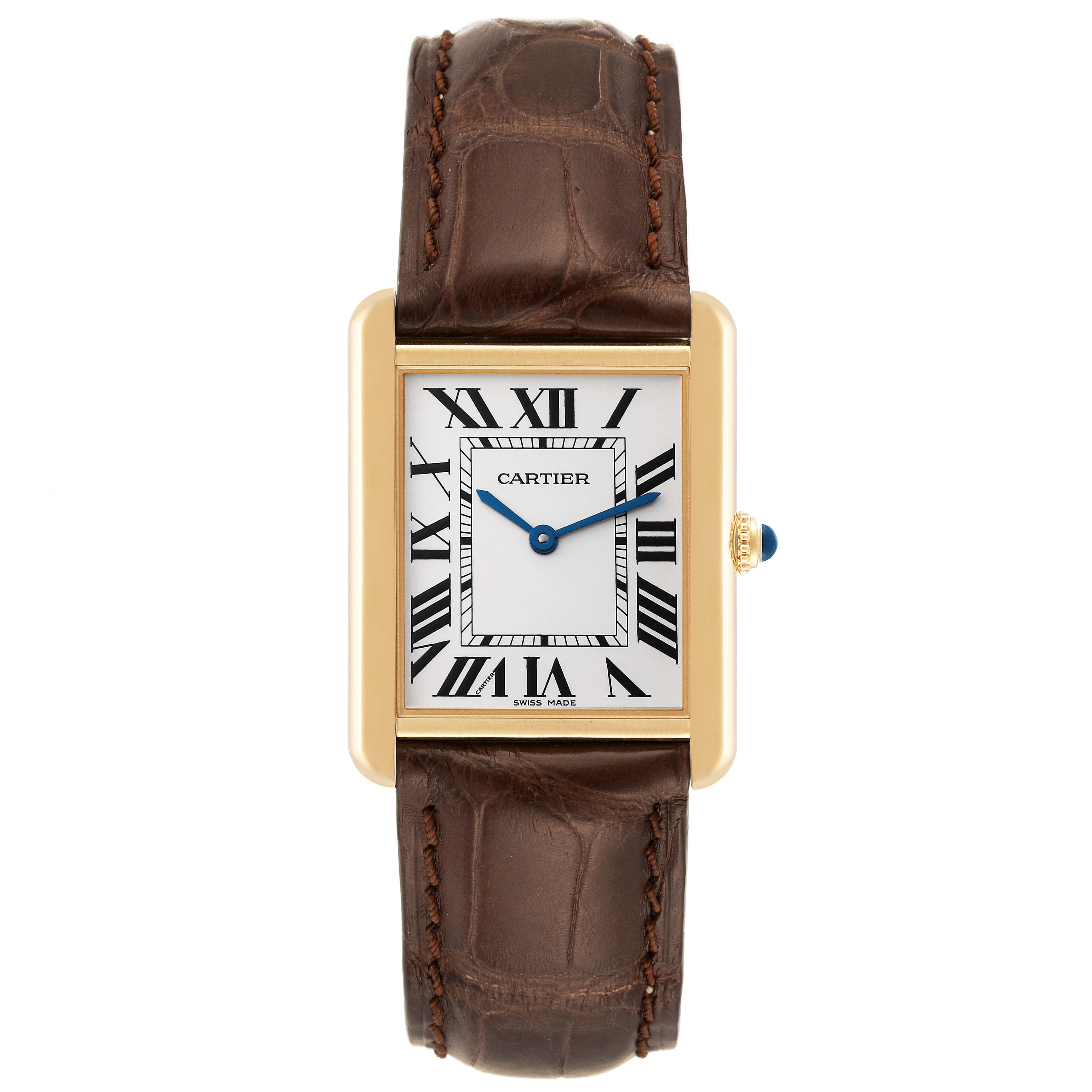 Cartier Tank Solo Large Yellow Gold Steel Mens Watch W5200004. Quartz movement. 18k yellow gold case 34 mm x 27 mm. Stainless steel case back. Circular grained crown set with a blue spinel cabochon. . Scratch resistant sapphire crystal. Silver