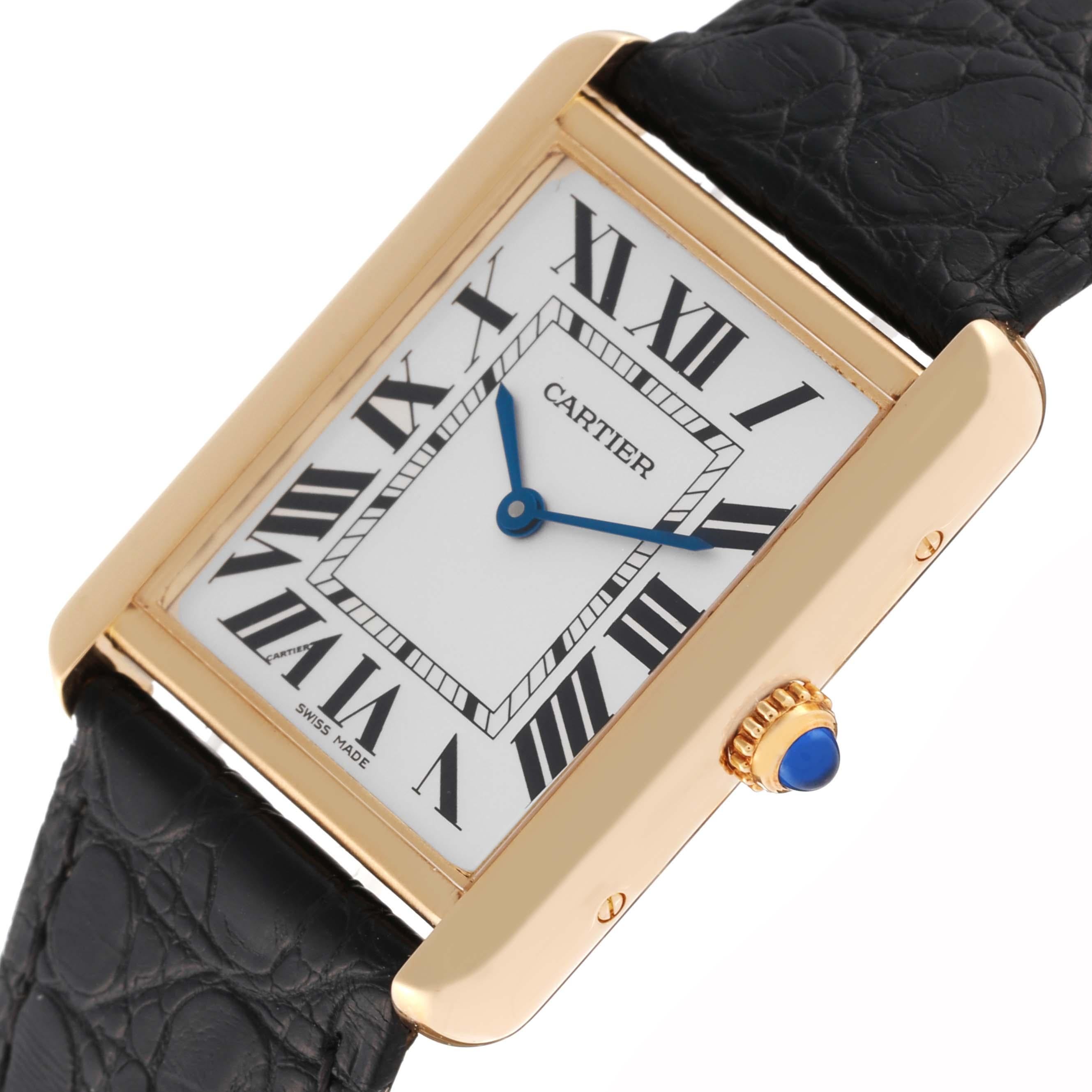 Cartier Tank Solo Large Yellow Gold Steel Mens Watch W5200004. Quartz movement. 18k yellow gold case 34 mm x 27 mm. Stainless steel caseback. Circular grained crown set with a blue spinel cabochon. . Scratch resistant sapphire crystal. Silver