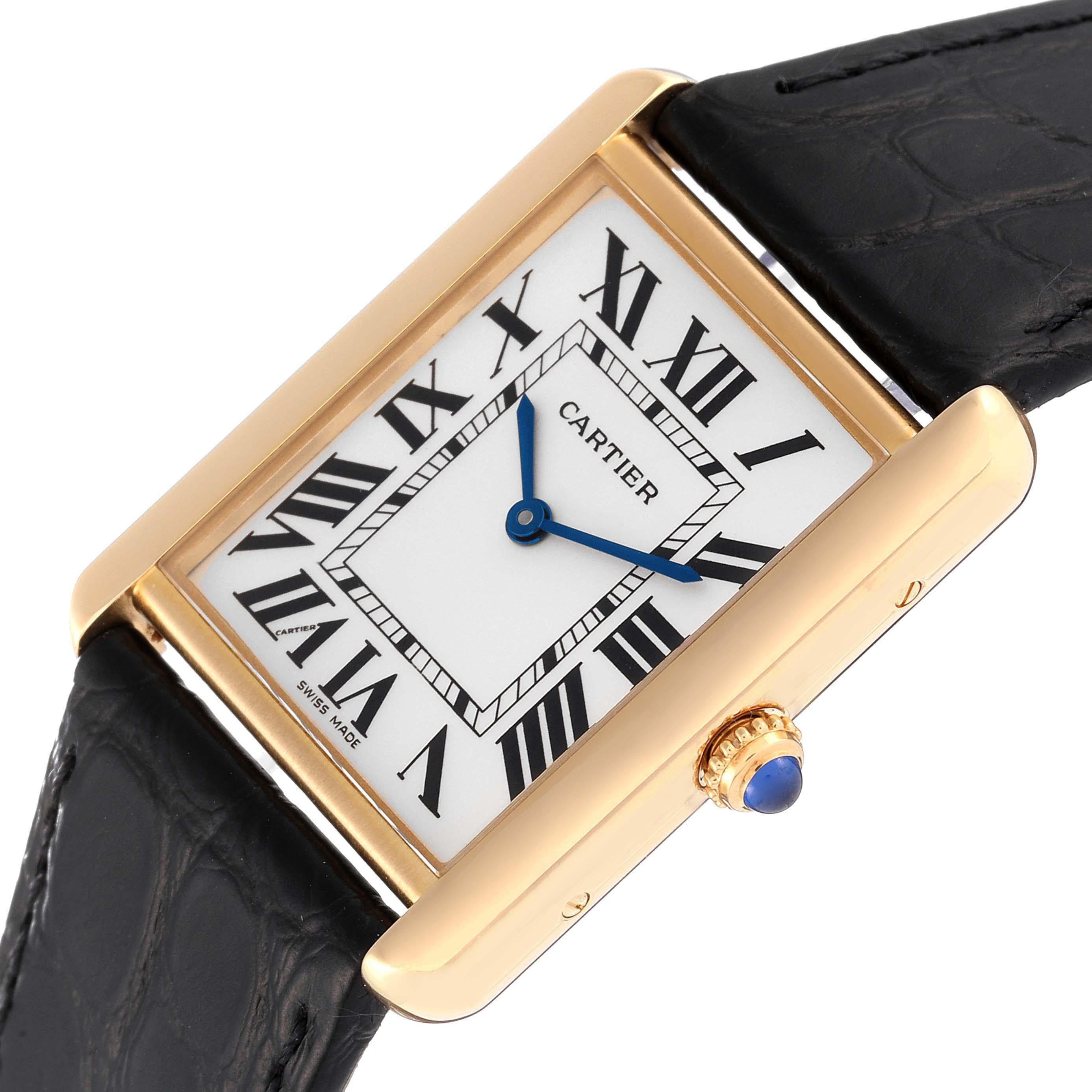 Cartier Tank Solo Large Yellow Gold Steel Mens Watch W5200004 Papers. Quartz movement. 18k yellow gold case 34 mm x 27 mm. Stainless steel caseback. Circular grained crown set with a blue spinel cabochon. . Scratch resistant sapphire crystal. Silver