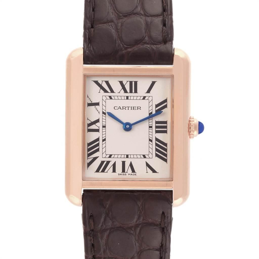 Cartier Tank Solo Rose Gold Steel Brown Dial Ladies Watch W5200024. Quartz movement. 18k rose gold and steel back case 30.0 x 23.0 mm. Circular grained crown set with the blue spinel cabochon. Scratch resistant sapphire crystal. Opaline silver dial.