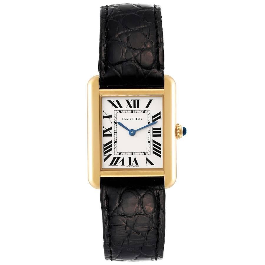 Cartier Tank Solo Small Yellow Gold Steel Silver Dial Ladies Watch W1018755. Quartz movement. 18k yellow gold and steel back case 30.0 x 23.0 mm. Blued steel sword-shaped hands. Circular grained crown set with a blue spinel cabochon. . Scratch