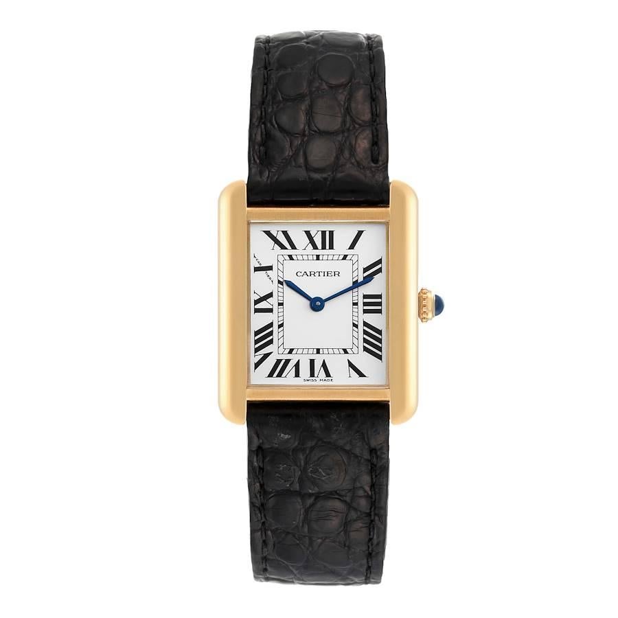 Cartier Tank Solo Small Yellow Gold Steel Silver Dial Ladies Watch W1018755. Quartz movement. 18k yellow gold case 30.0 x 23.0 mm. Stainless steel case back. Blued steel sword-shaped hands. Circular grained crown set with a blue spinel cabochon. .