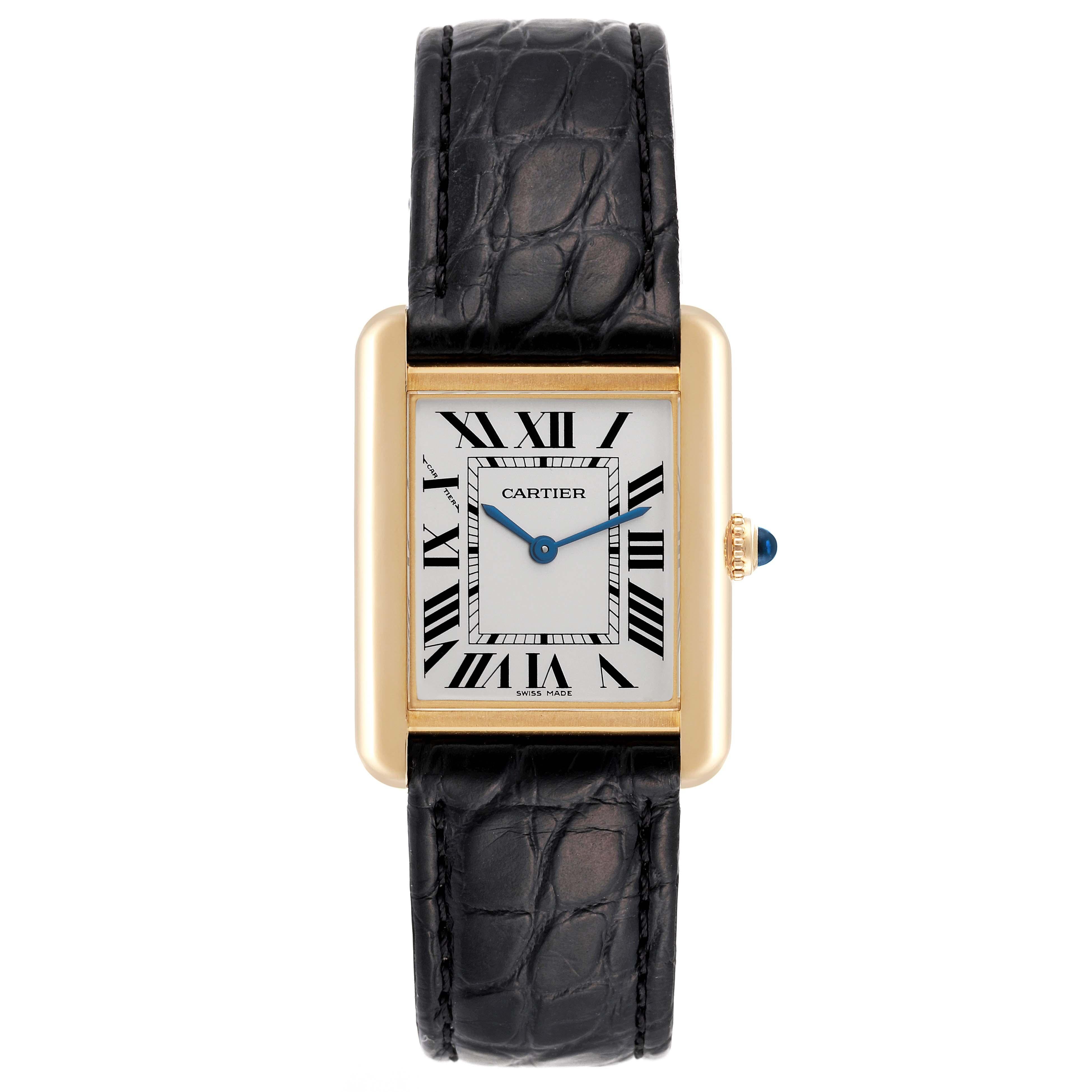 Cartier Tank Solo Small Yellow Gold Steel Silver Dial Ladies Watch W1018755. Quartz movement. 18k yellow gold case 30 x 23 mm. Stainless steel case back. Circular grained crown set with a blue spinel cabochon. . Scratch resistant sapphire crystal.