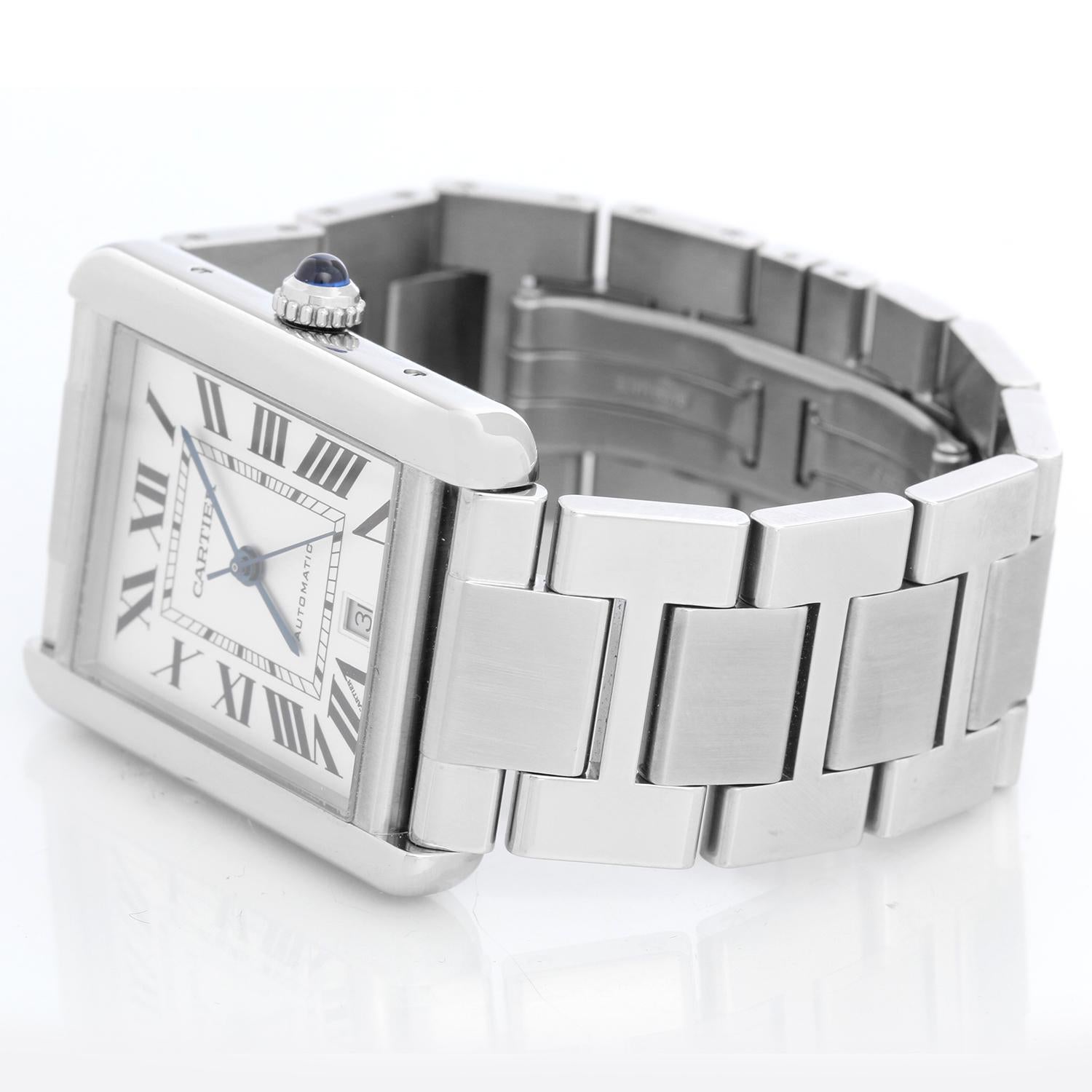 Cartier Tank Solo Stainless Steel XL WSTA0053 3800 - Automatic. Stainless steel  (31 x 41mm). Silver dial with black Roman numerals with date at 6 o'clock. Stainless Steel Cartier bracelet; will fit a 7 inch wrist . Pre-owned with custom box.
