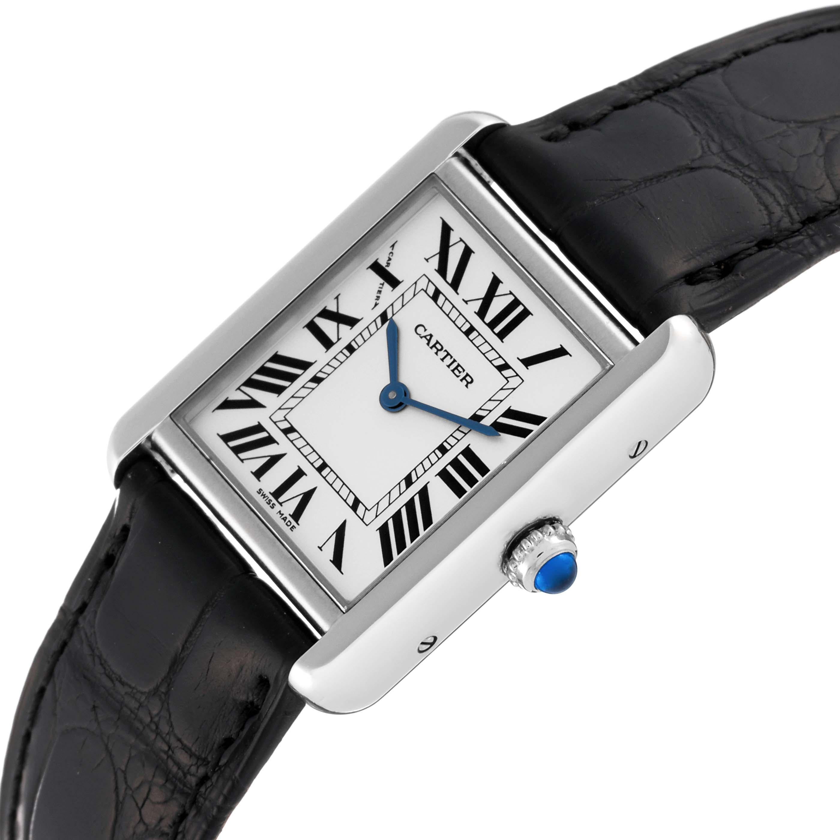 Cartier Tank Solo Steel Black Strap Ladies Watch W5200005. Quartz movement. Stainless steel case 31.0 x 24.0 mm. Circular grained crown set with the blue spinel cabochon. . Scratch resistant sapphire crystal. Silver opaline dial with black Roman