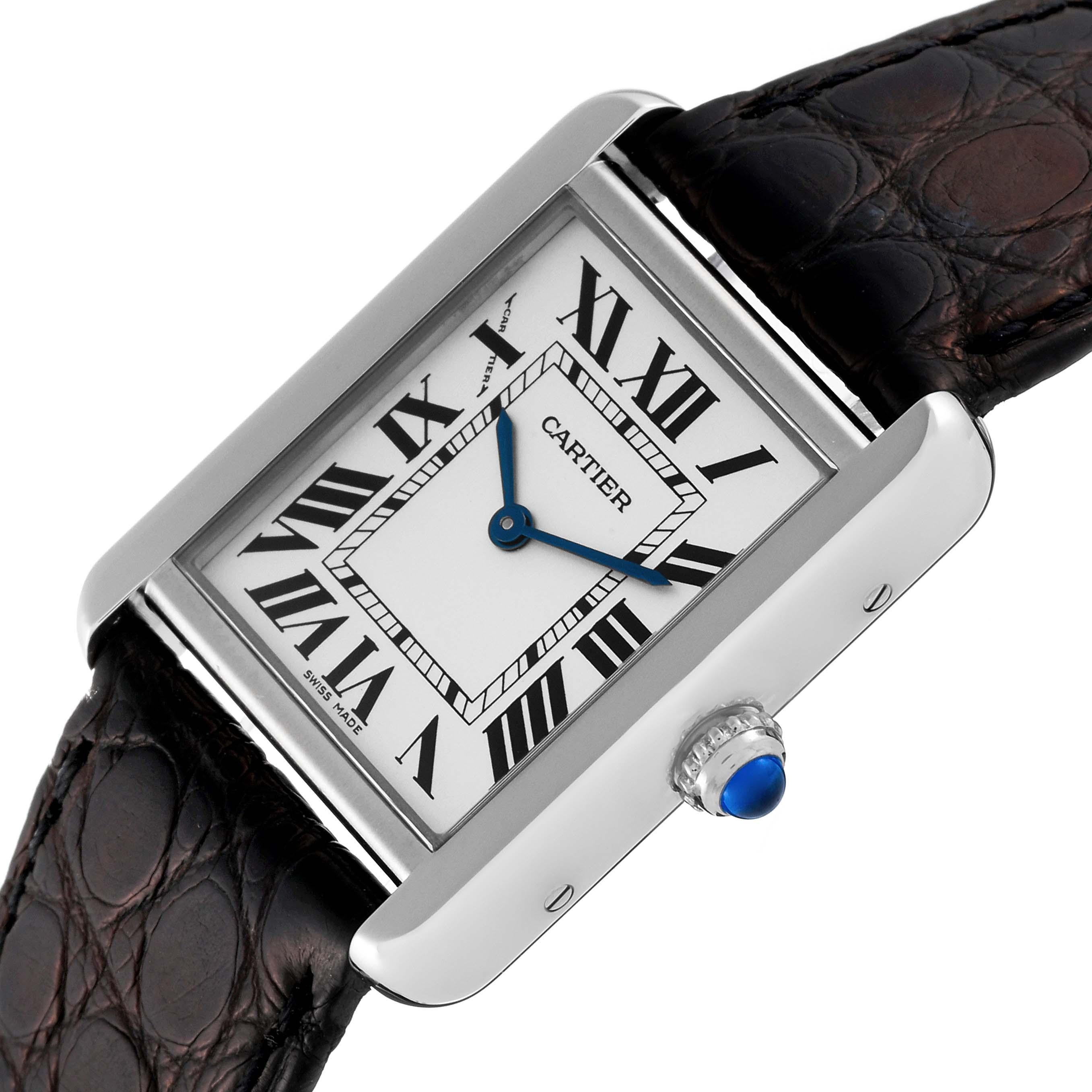 Cartier Tank Solo Steel Black Strap Quartz Ladies Watch W1018255 Box Papers. Quartz movement. Stainless steel case 30.0 x 23.0 mm. Circular grained crown set with a blue spinel cabochon. . Scratch resistant sapphire crystal. Silver opaline dial with