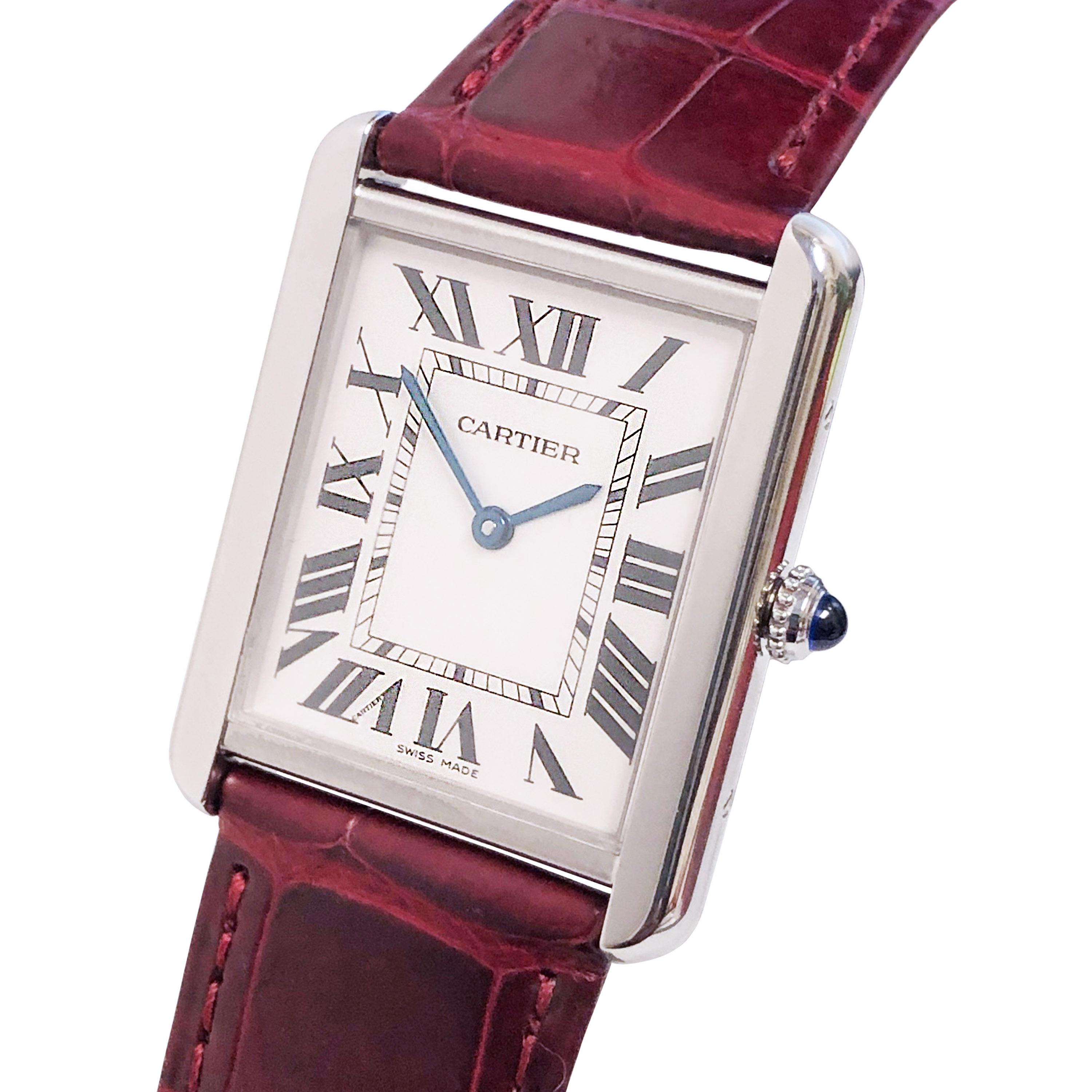Circa 2014 Cartier Tank Solo Wrist Watch. 34 X 28 MM Stainless Steel Case, blue sapphire crown, Scratch resistant sapphire crystal. Quartz Movement. Silver Satin dial with Black Roman numerals. Sword shaped blued steel hands including a sweep