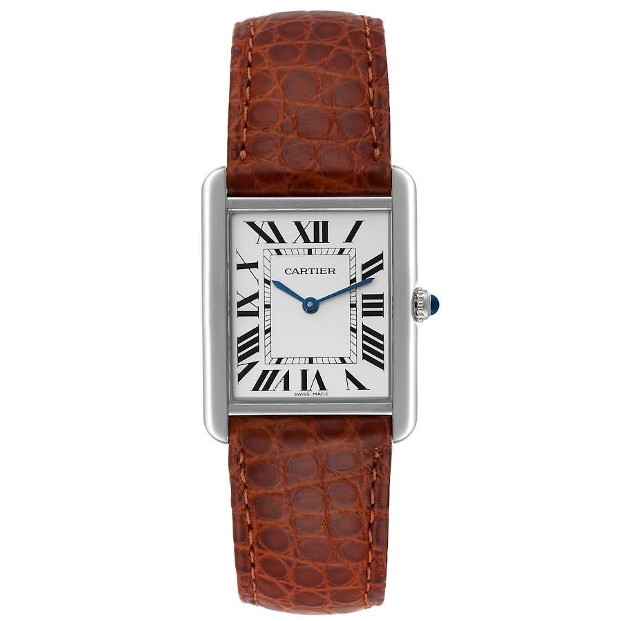 Cartier Tank Solo Steel Silver Dial Brown Strap Unisex Watch W1018355. Quartz movement. Stainless steel case 27.0 x 34.0 mm. Circular grained crown set with the blue spinel cabochon. . Scratch resistant sapphire crystal. Silver opaline dial. Painted