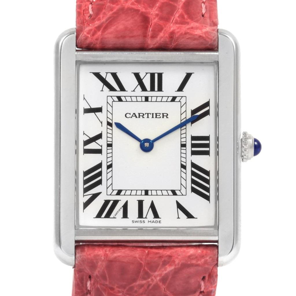 Cartier Tank Solo Steel Silver Dial Pink Strap Unisex Watch W1018355. Quartz movement. Stainless steel case 27.0 x 34.0 mm. Circular grained crown set with the blue spinel cabochon. Scratch resistant sapphire crystal. Silver opaline dial. Painted