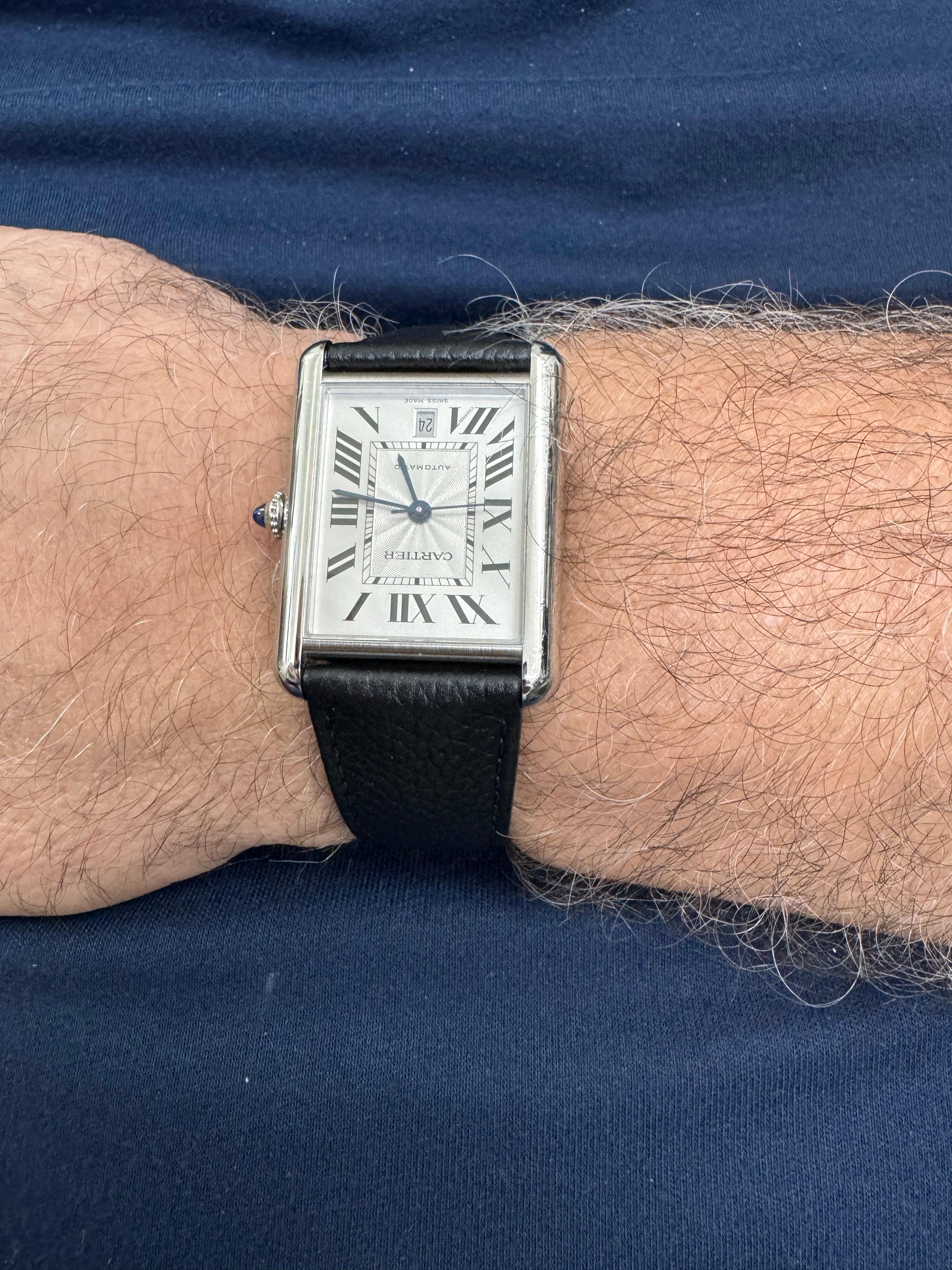 Elevate your wrist with timeless sophistication in this Cartier Tank Solo XL Automatic, a contemporary reinterpretation of Cartier’s iconic Tank design. Crafted in polished stainless steel, the rectangular case measures a refined 31mm x 40.85mm,