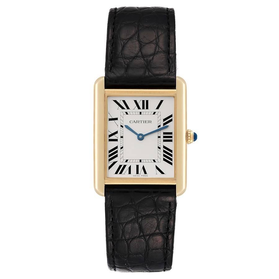 Cartier Tank Solo Yellow Gold Steel Black Strap Mens Watch W1018855. Quartz movement. 18k yellow gold/steel back case 34.0 x 27.0 mm. Circular grained crown set with a blue spinel cabochon. . Scratch resistant sapphire crystal. Silver opaline dial.