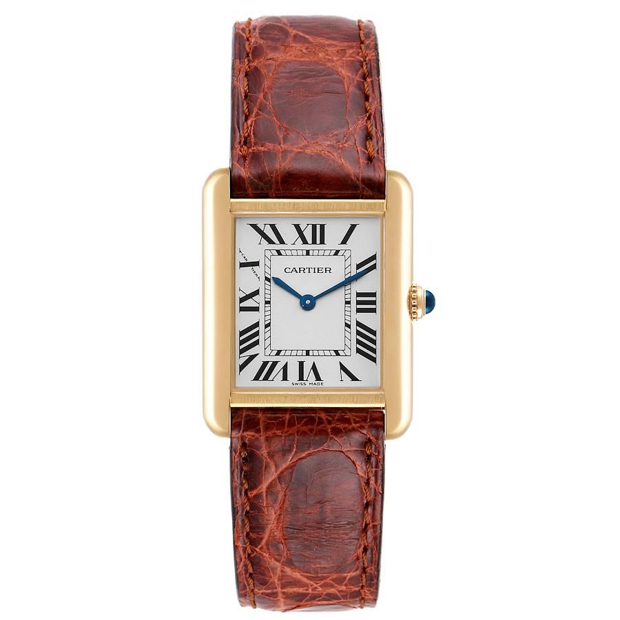 Cartier Tank Solo Yellow Gold Steel Silver Dial Ladies Watch W1018755. Quartz movement. 18k yellow gold and steel back case 30.0 x 23.0 mm. Circular grained crown set with the blue spinel cabochon. . Scratch resistant sapphire crystal. Opaline