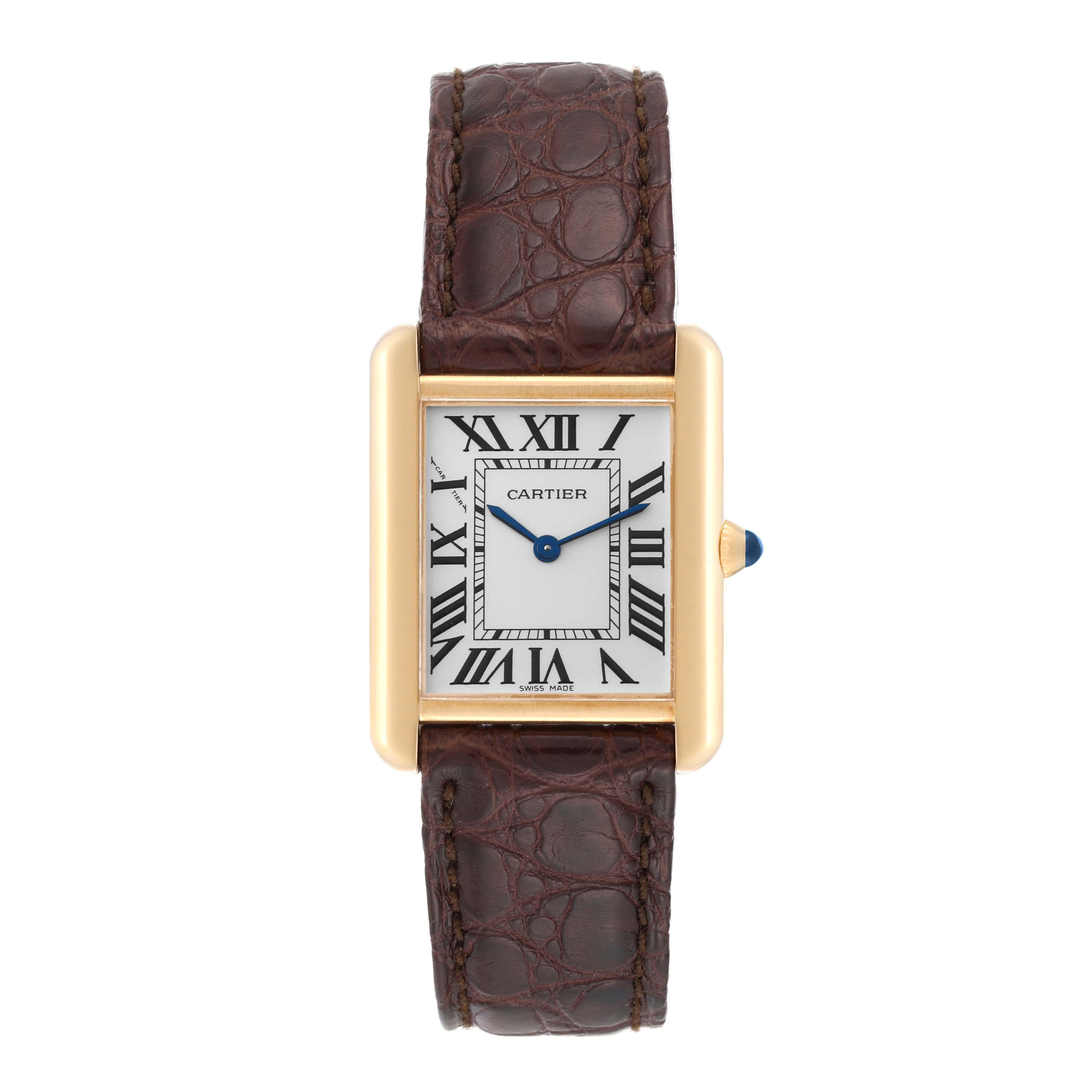 Cartier Tank Solo Yellow Gold Steel Silver Dial Ladies Watch W1018755. Quartz movement. 18k yellow gold case 30.0 x 23.0 mm. Stainless steel caseback. Circular grained crown set with a blue spinel cabochon. . Scratch resistant sapphire crystal.