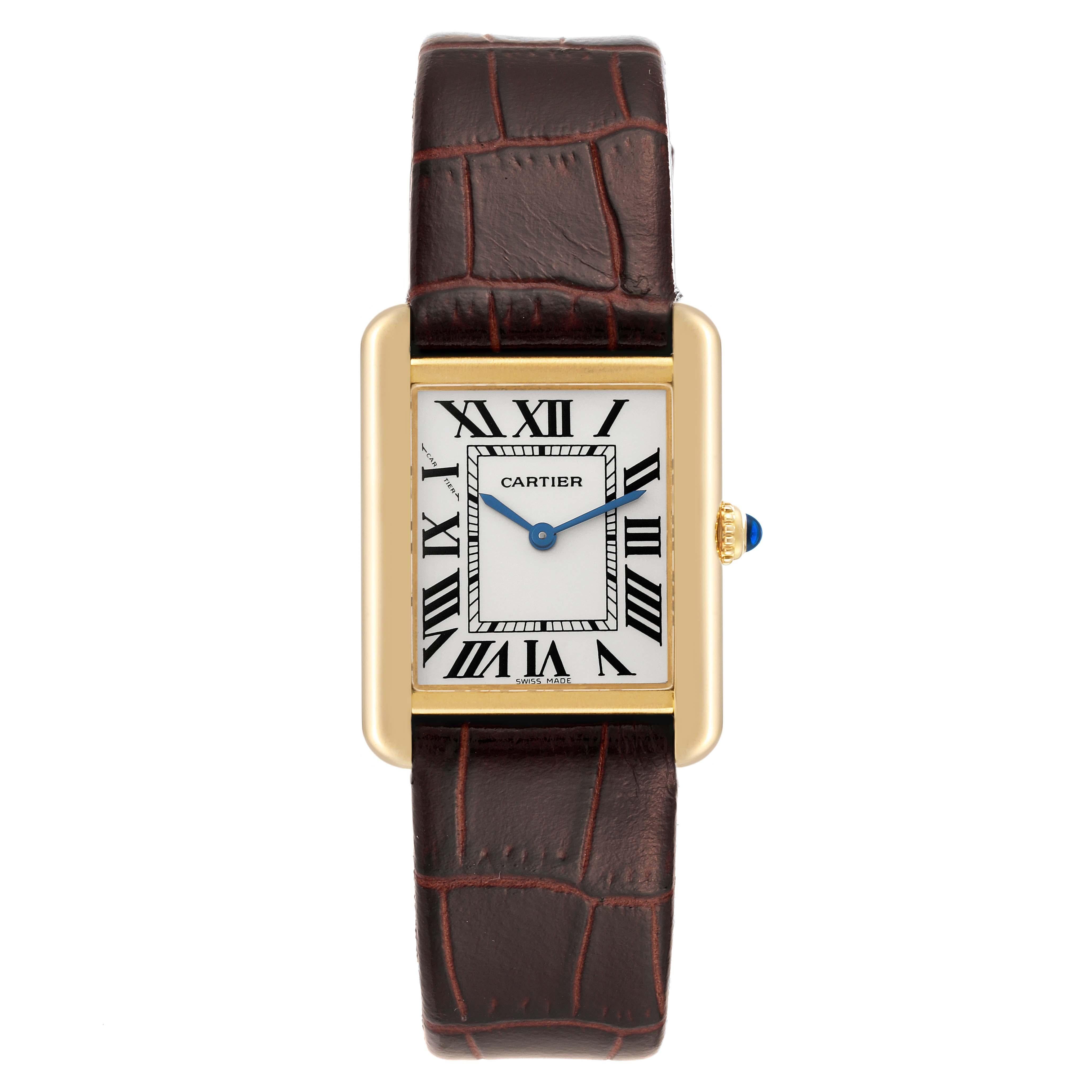 Cartier Tank Solo Yellow Gold Steel Silver Dial Ladies Watch W5200002. Quartz movement. 18k yellow gold case 30.0 x 24.4 mm. Stainless steel case back. Circular grained crown set with the blue spinel cabochon. . Scratch resistant sapphire crystal.