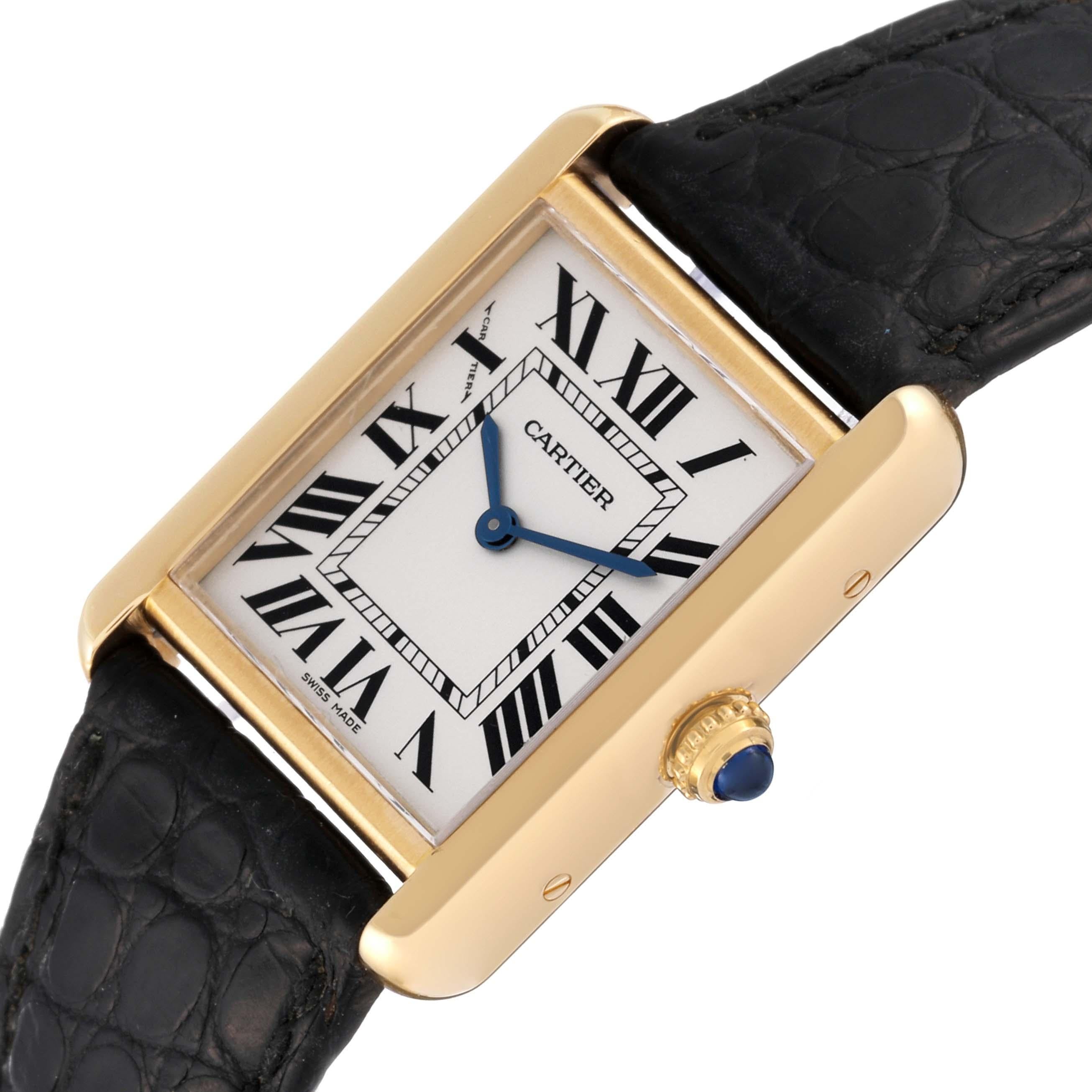 Cartier Tank Solo Yellow Gold Steel Silver Dial Ladies Watch W5200002. Quartz movement. 18k yellow gold case 30.0 x 24.4 mm. Stainless steel caseback. Circular grained crown set with blue spinel cabochon. . Scratch resistant sapphire crystal.