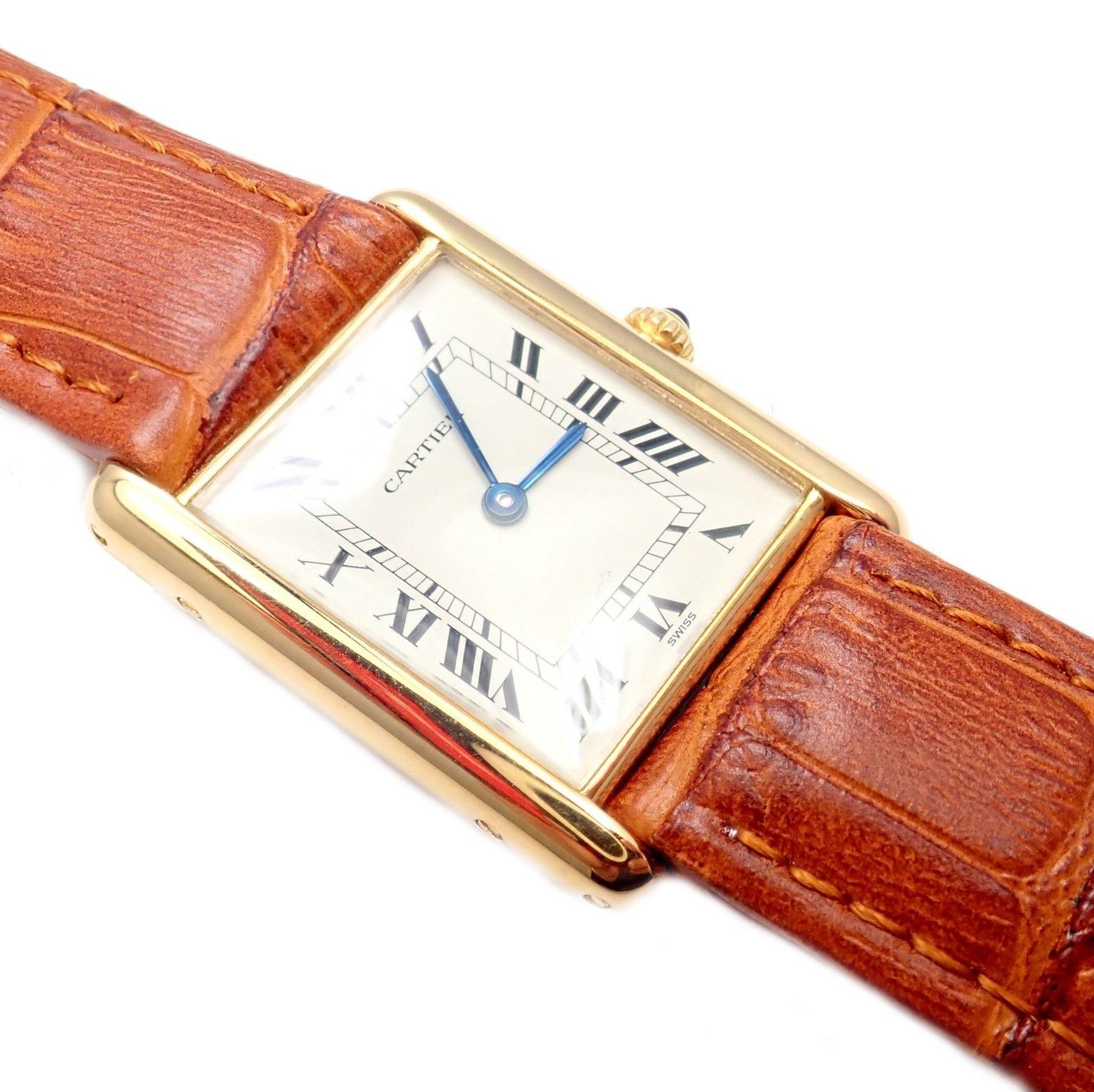 18k yellow gold tank unisex quartz wristwatch by Cartier.
Details: 
Case Dimensions: 23mm x 30mm
Length: Fits 8.25