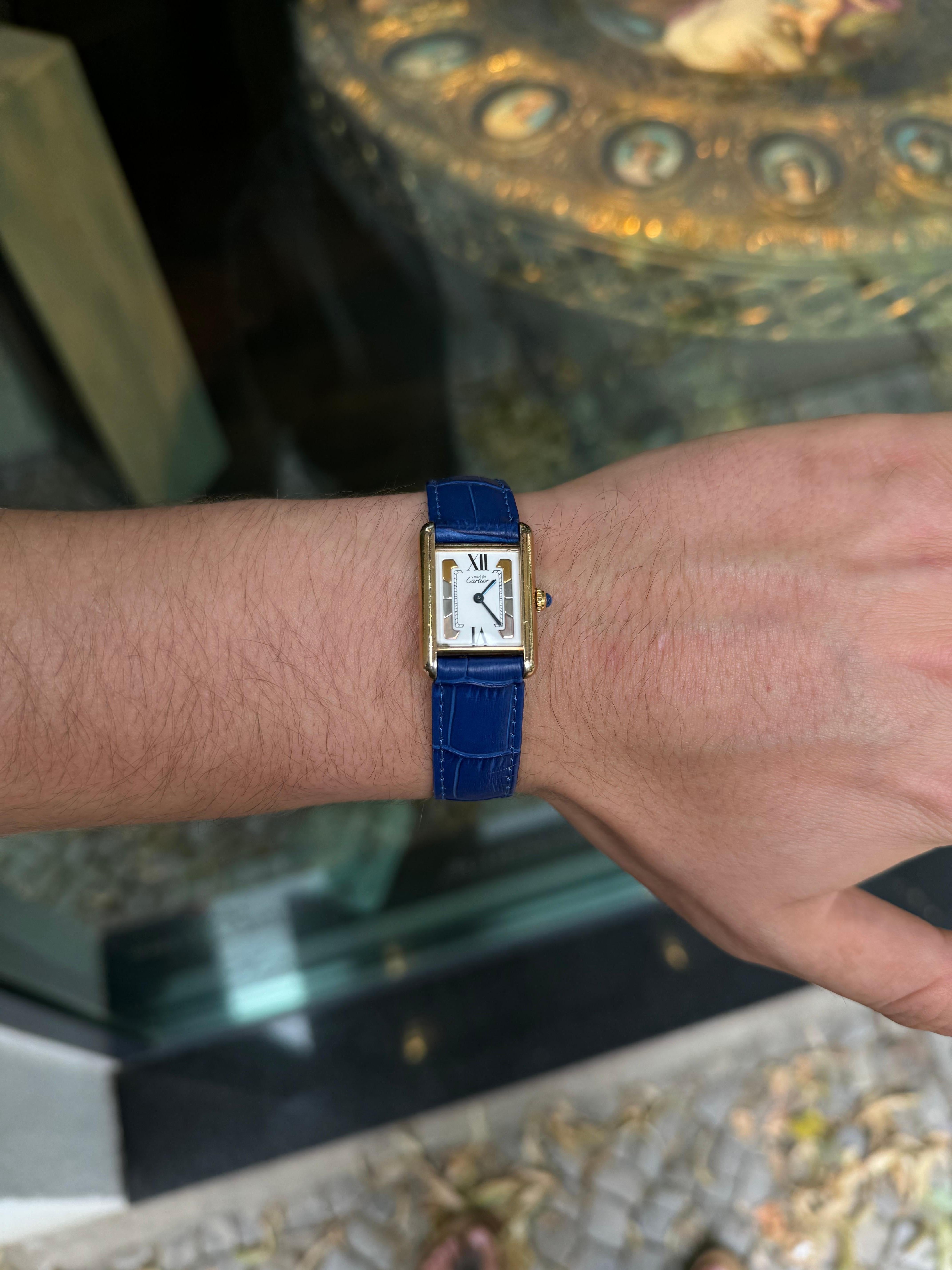 Behold the exquisite Cartier Tank Vermeil, a paragon of timeless elegance. Crafted from sterling silver, this masterpiece exudes a sublime sophistication. Its heart, powered by a precision quartz movement, beats with unparalleled accuracy. Adorning