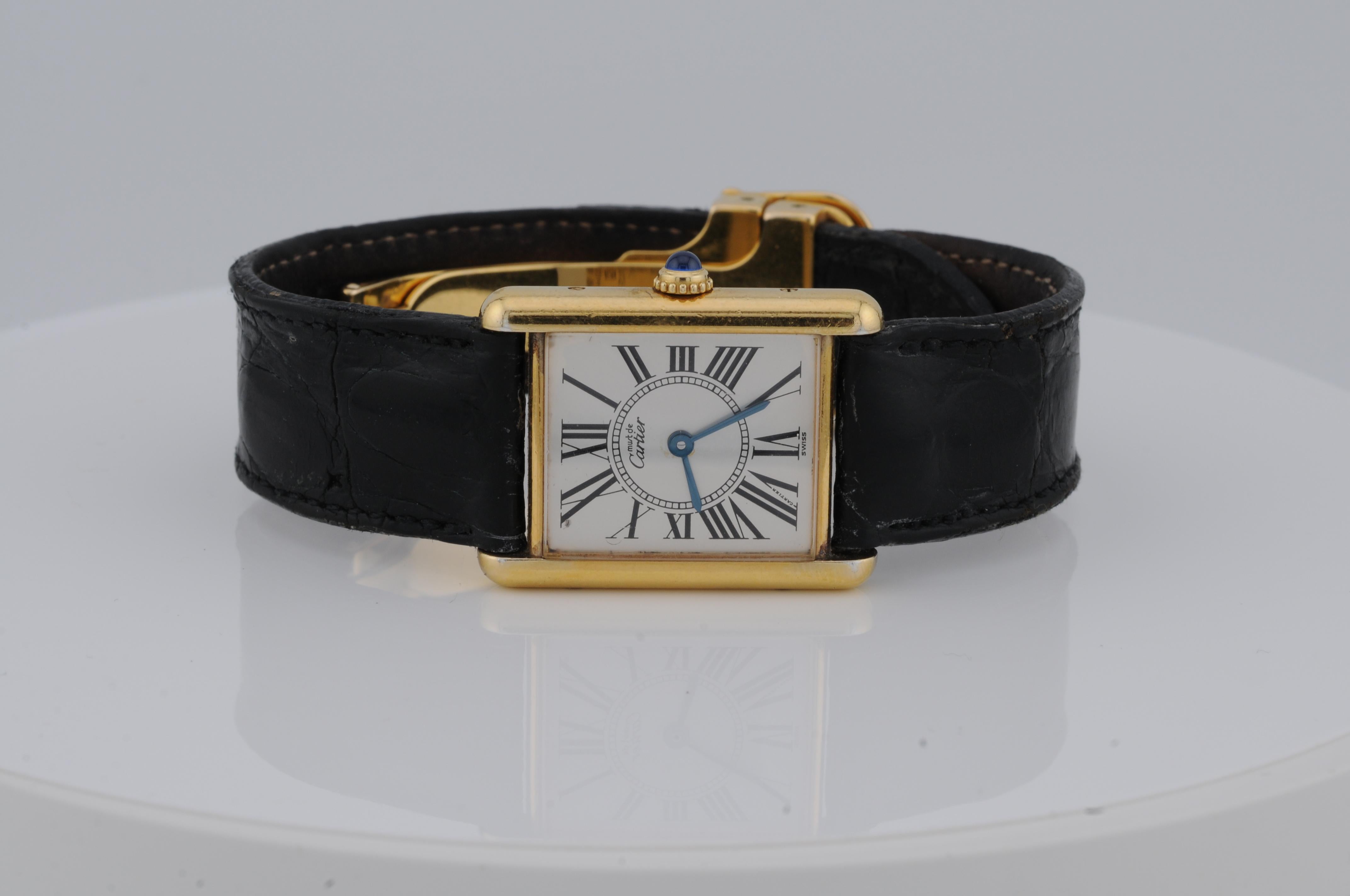 Cartier Tank Vermeil Ref. 590005 – Gold-Plated 925 Silver Quartz Watch

This elegant Cartier Tank Vermeil Ref. 590005 features a gold-plated 925 silver case with a classic Roman numeral dial. Powered by a quartz movement, it retains the timeless