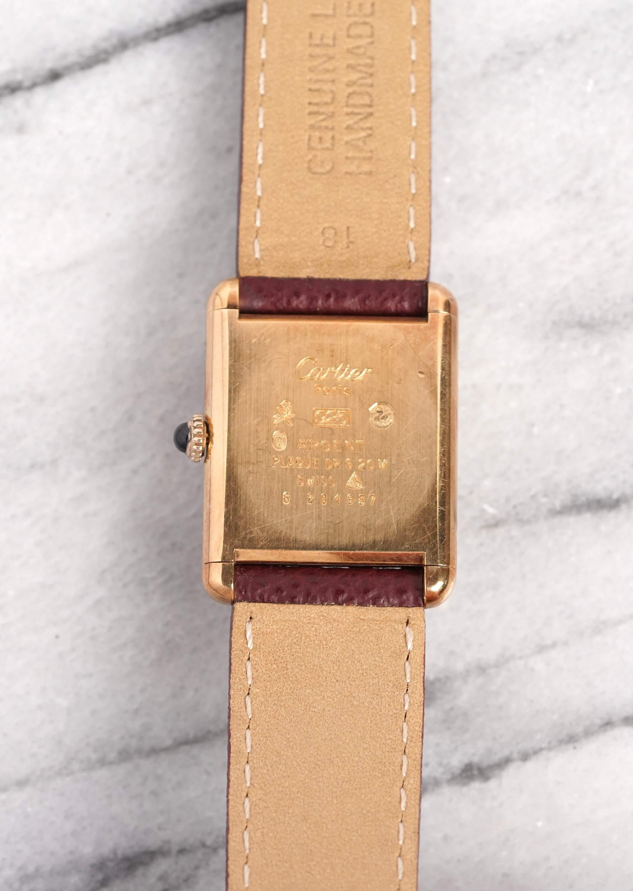 Here’s a vintage Must de Cartier Tank manual wind with a red lacquer dial from the late 70s, early 80s. Keeps great time and is fully functional. Measurements include a 23x30mm tank case size and 18mm lug width. It's on a maroon pebble textured