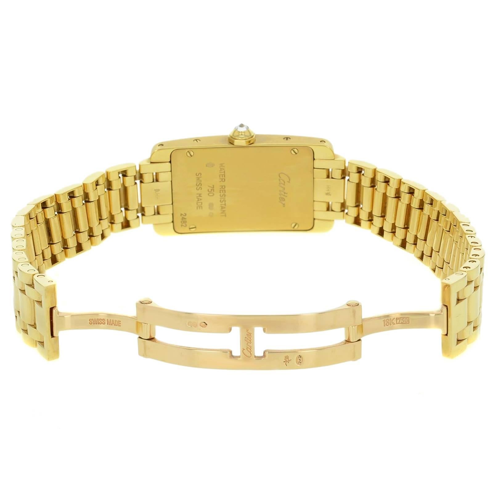 Brand: Cartier
Series: Tank
Model Number: WB7043JQ 
Case Material: Yellow Gold
Case Shape: Rectangle
Case Diameter: 19 mm
Case Thickness: 7 mm
Bezel Type: Fixed
Bezel Features: Factory Diamond Bezel
Bezel Material: Yellow Gold
Dial Color: