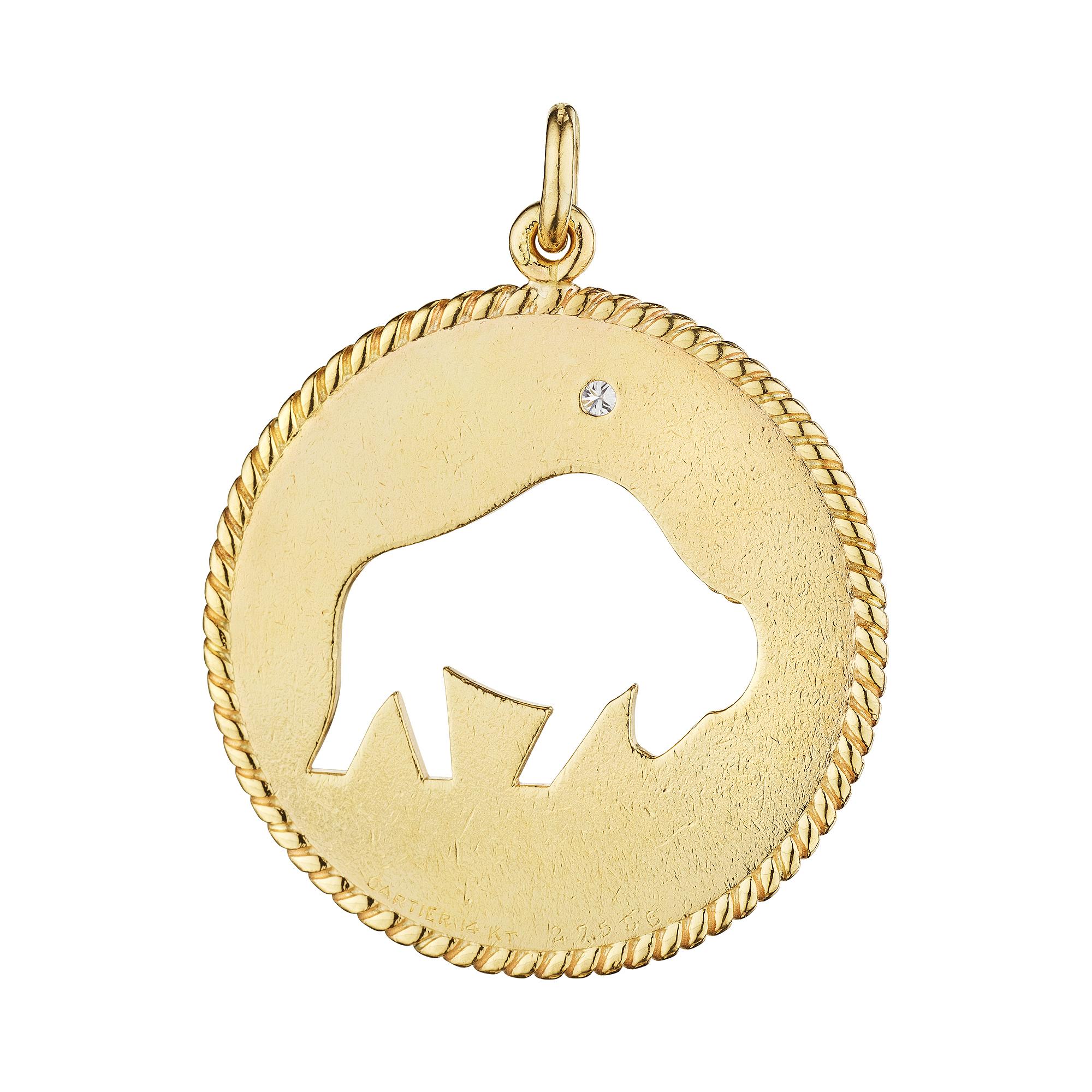 Be bullish with this modernist Cartier Taurus zodiac diamond and gold pendant charm. Representing the power of the bull and those born between April 20th-May 20th, this strikingly collectible jewel is stylishly forceful.  Signed Cartier. Circa 1970.
