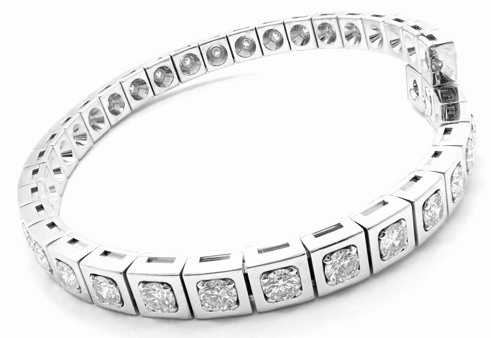 18k White Gold Diamond Tectonique Tennis Bangle Bracelet by Cartier. 
With 36 Round Brilliant Cut Diamonds VVS1clarity, E color total weight approximately 5.76ct
Details: 
Length: 7