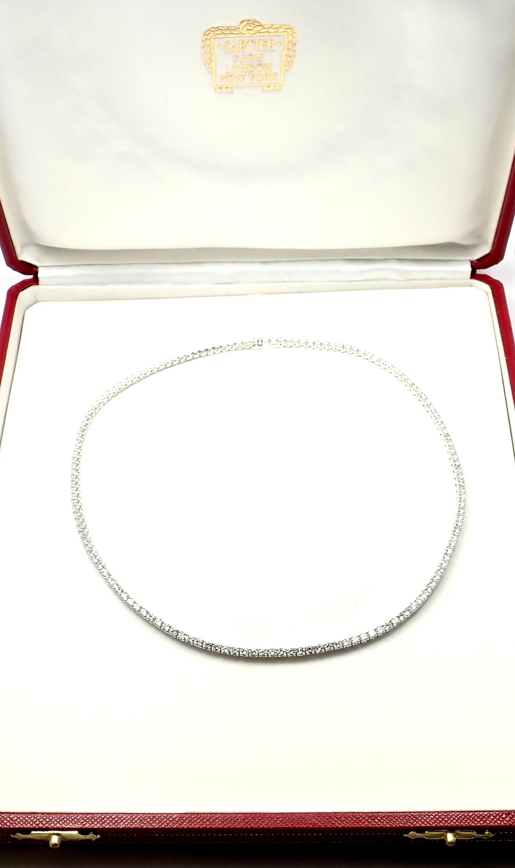 18k White Gold Diamond Line Tennis Necklace by Cartier. 
With 150 Round brilliant cut diamonds VVS1 clarity E color Total Diamond Weight approx. 9.75ct
This necklace comes with an original Cartier box and Cartier certificate.
Details: 
Chain Length: