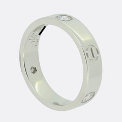 Cartier LOVE Ring mit drei Diamanten, Größe V (63)