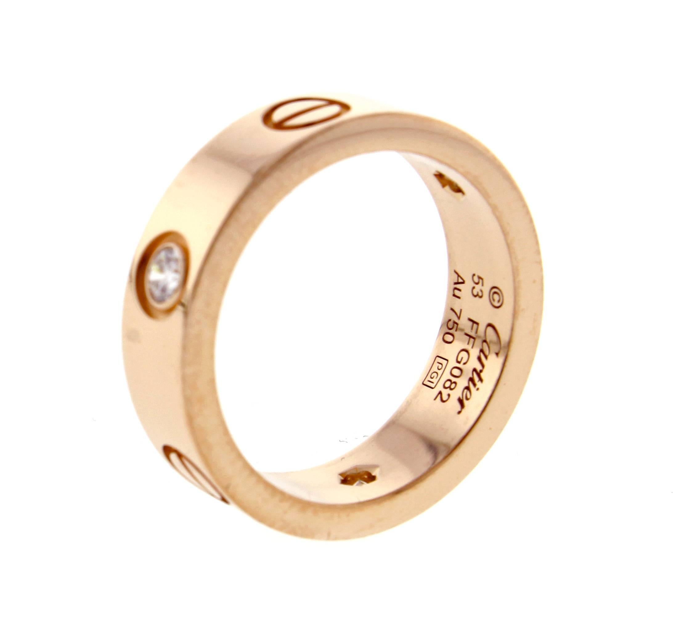 A child of 1970s New York, the Cartier LOVE collection remains today an iconic symbol of love.   18 karat pink gold, 3 diamonds weigh .22 carats, 5mm wide, size 53, US 6¼ 