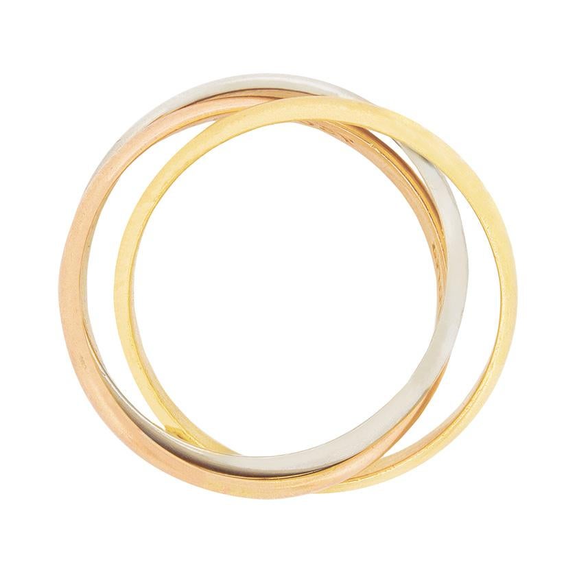 This classic Cartier ring is their three gold trinity piece. It is three bands of 18 carat gold, one yellow, one white and one pink. The bands are entwined with one another and the pink band has the makers mark for Cartier.
Designer: Cartier
Metal: