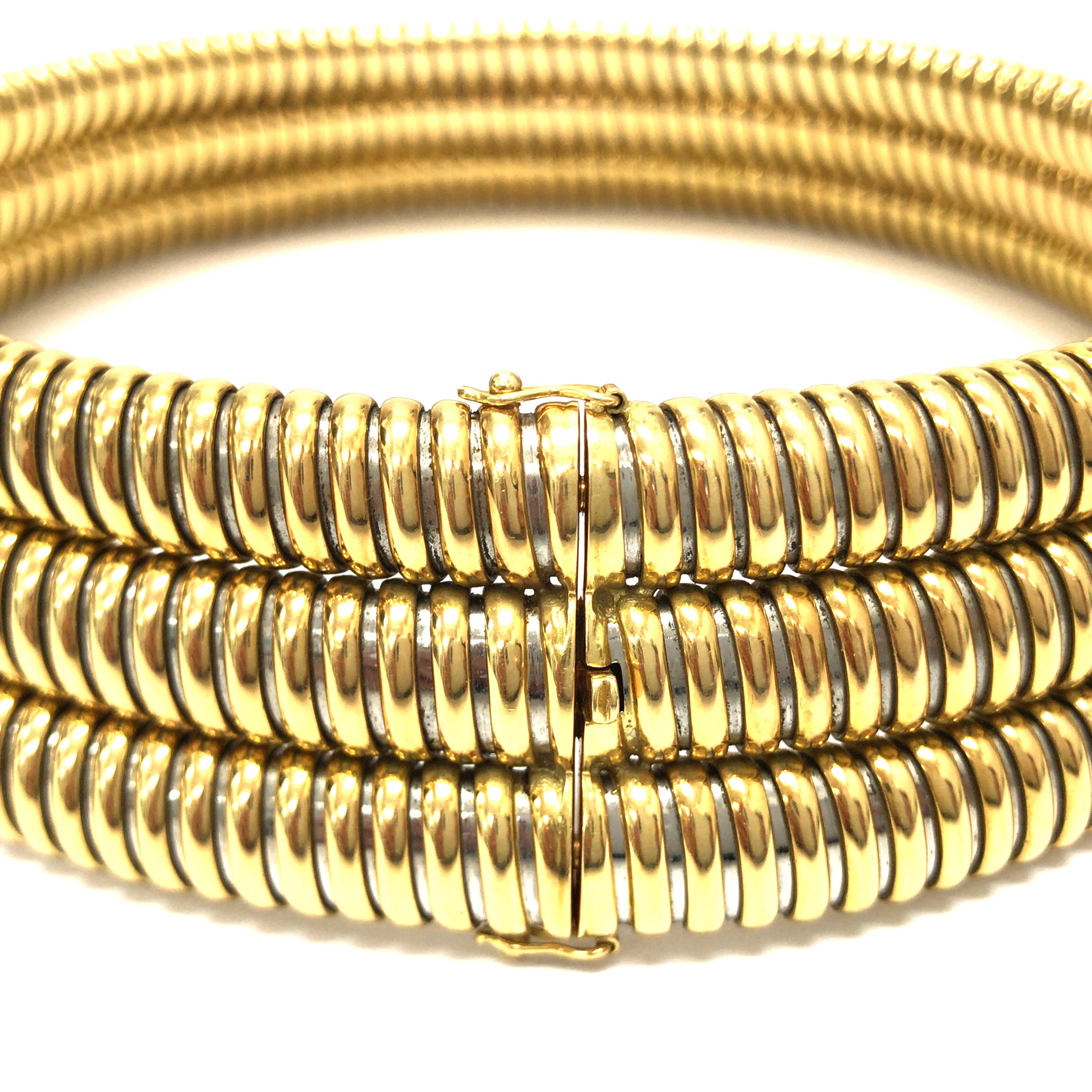 Cartier Steel Gold Three Row Tubogaz Necklace. Circa 1980. Made with three Stainless Steel and 18K Yellow Yold 