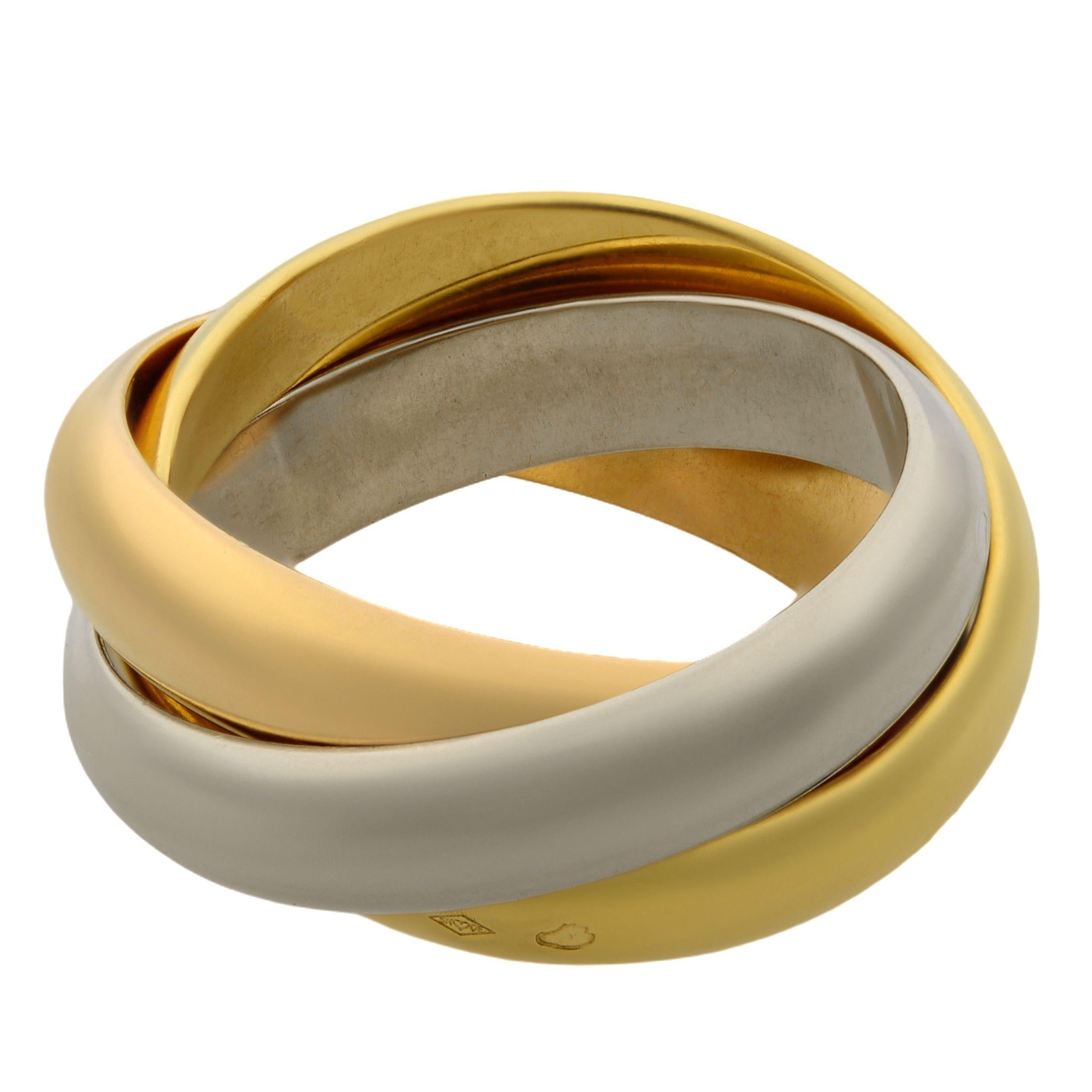 Trinity ring from Cartier, medium model, 18K white gold, 18K pink gold, 18K yellow gold. This Cartier Trinity ring is pre-owned in a very good condition, old model. No box no papers. Ring size 53, US 6.5. Each band is 4mm.
The three interlaced bands