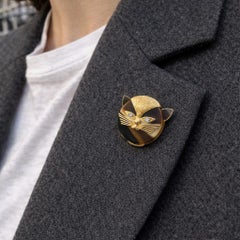 Broche felino ojo de tigre Cartier Francia, 1970