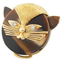 Broche felino ojo de tigre Cartier Francia, 1970