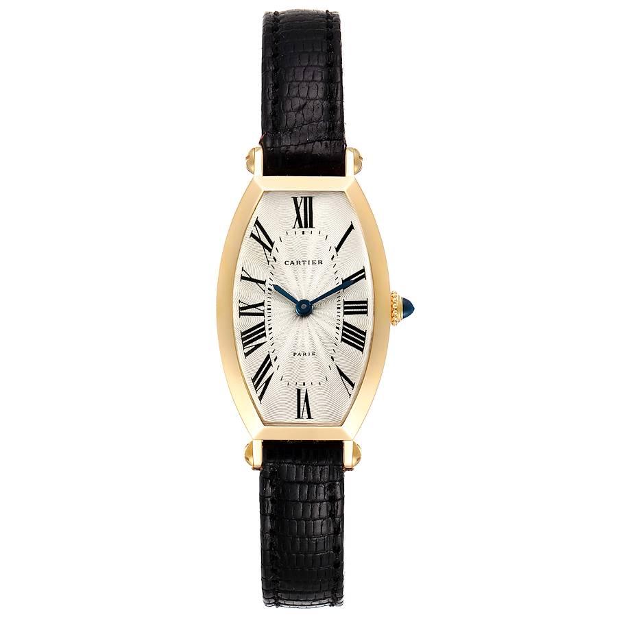 Cartier Tonneau 18K Yellow Gold Silver Dial Ladies Watch. Manual winding movement. 18K yellow gold tonneau shape case 32.0 x 21.0 mm. Circular grained crown set with the blue. 18K yellow gold smooth bezel. Scratch resistant sapphire crystal. Silver