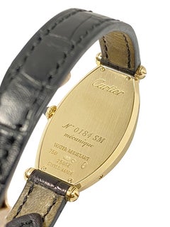Mechanische Damenarmbanduhr von Cartier Tonneau Privee aus Gelbgold