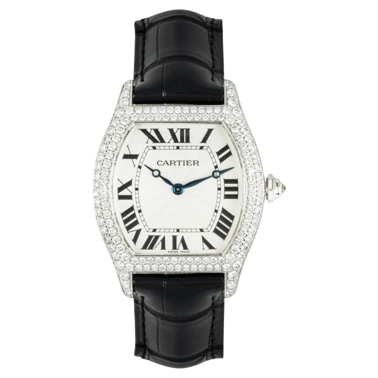 A ladies large 34mm Tortue wristwatch in white gold by Cartier. Features a silver guilloche dial with roman numerals and Cartier's own hidden signature at 'VII'. Complementing the dial is white gold bezel set with 130 round brilliant cut diamonds