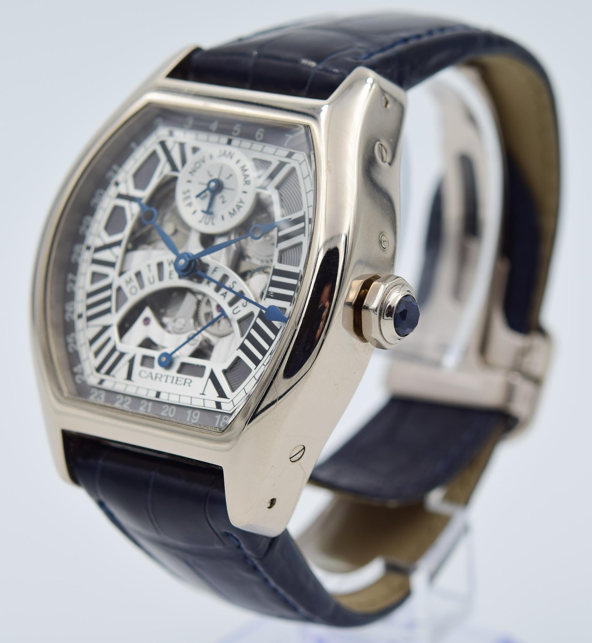 This Cartier came to us on trade recently and does have the full box and papers.  This Tortue features a skeleton dial with an incredible perpetual calendar!  The watch is an automatic piece with approximately a 46mm case in a tonneau shape.  The