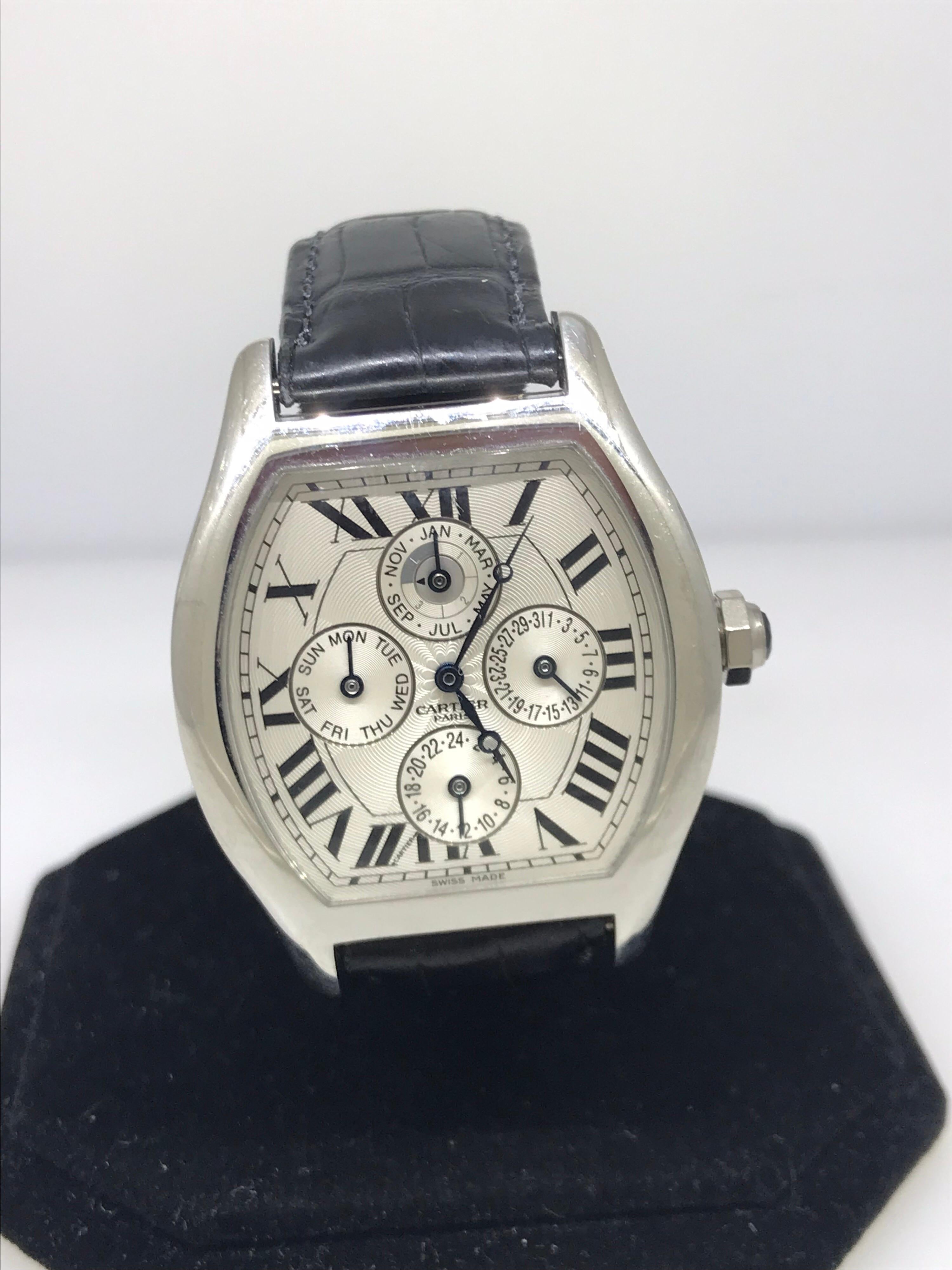 Cartier Tortue Men's Watch

Model Number: W1540551

100% Authentic

Pre owned in excellent condition

Comes with a generic watch box

Platinum Case

Silver dial and subdials

Watch Functions: Hours, Minutes, Day, Date, Month, Leap Year, Dual Time