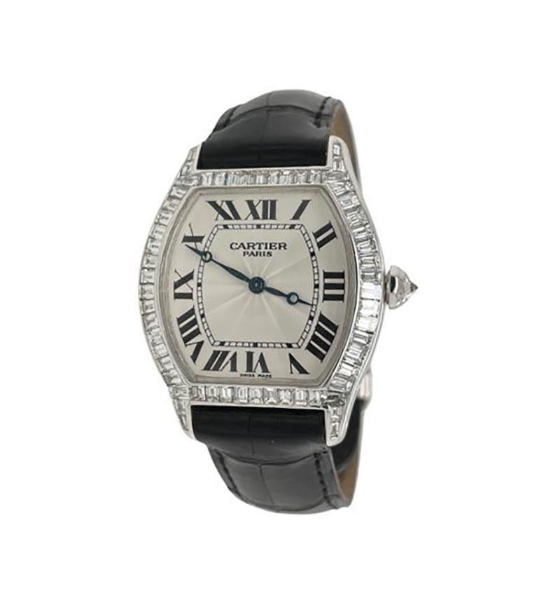 Brand: Cartier

Model Name: Tortue

Model Number: WGTO0003

Movement: Automatic

Case Size: 44 mm

Case Back: Solid

Case Material: 18k White Gold and Baguette cut diamonds

Dial: Guilloche White

Bracelet:  Black alligator

Hour Markers: Roman
